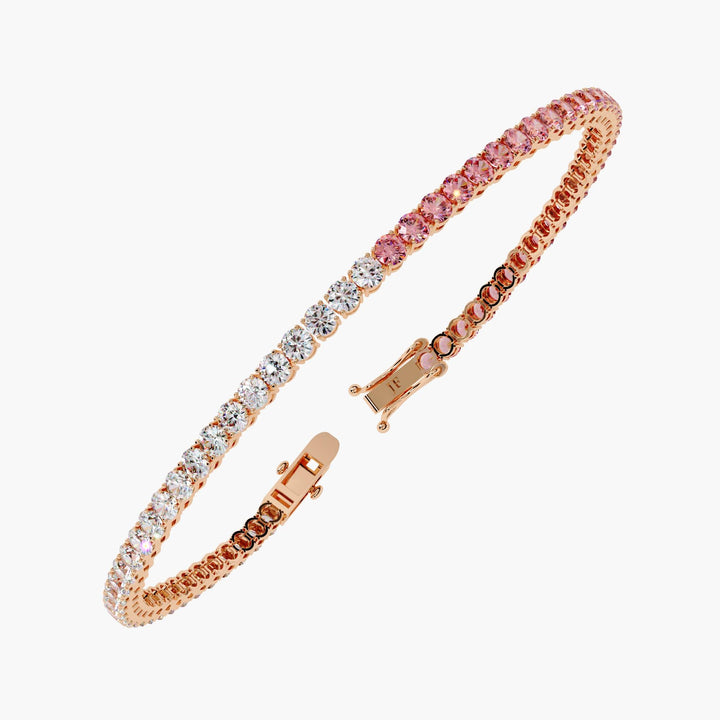 A bracelet with half round cut white diamonds and half round cut pink diamonds.