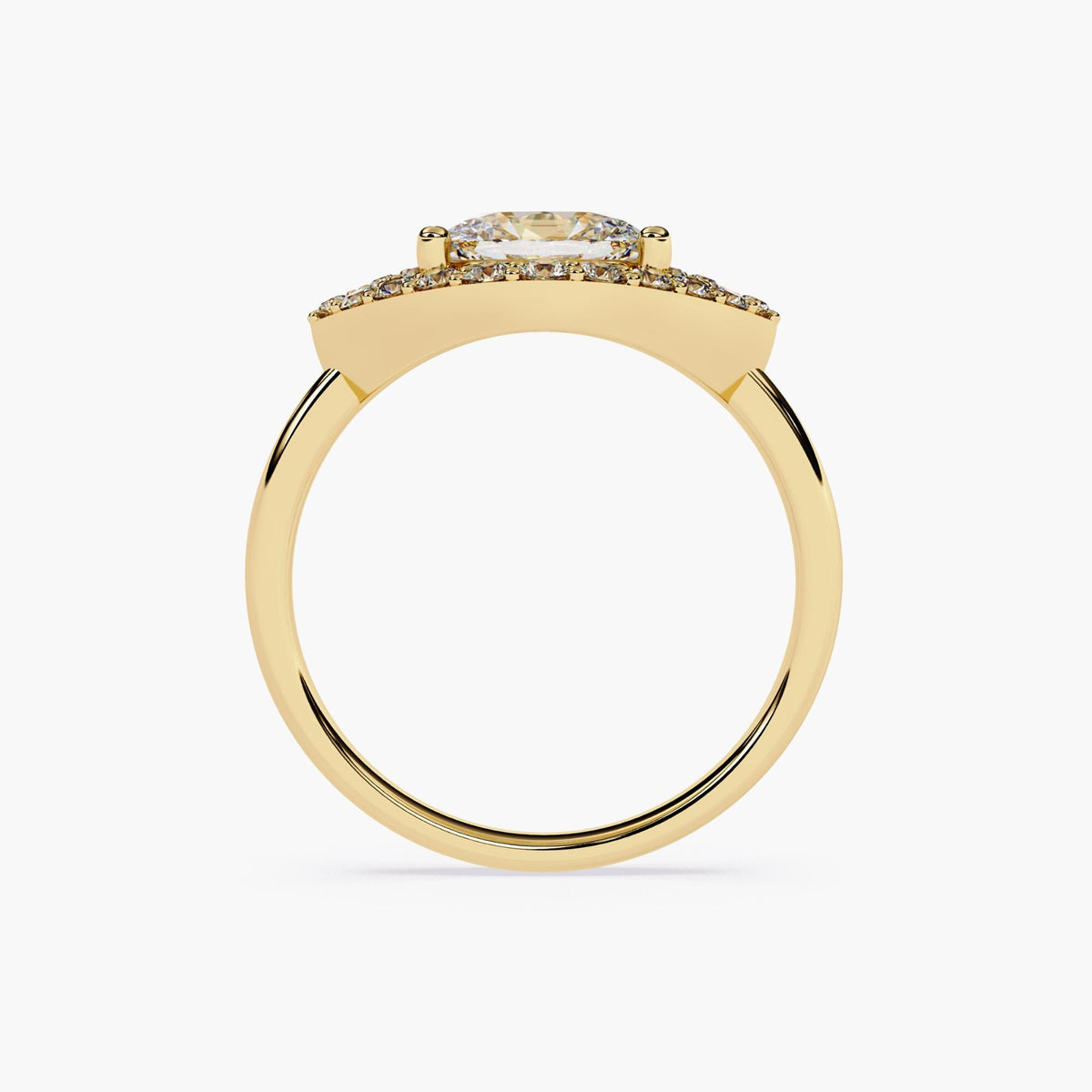 A gold engagement ring with a marquise cut diamond center stone and a halo of smaller diamonds.