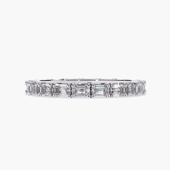 A white gold band with a row of emerald cut diamonds.