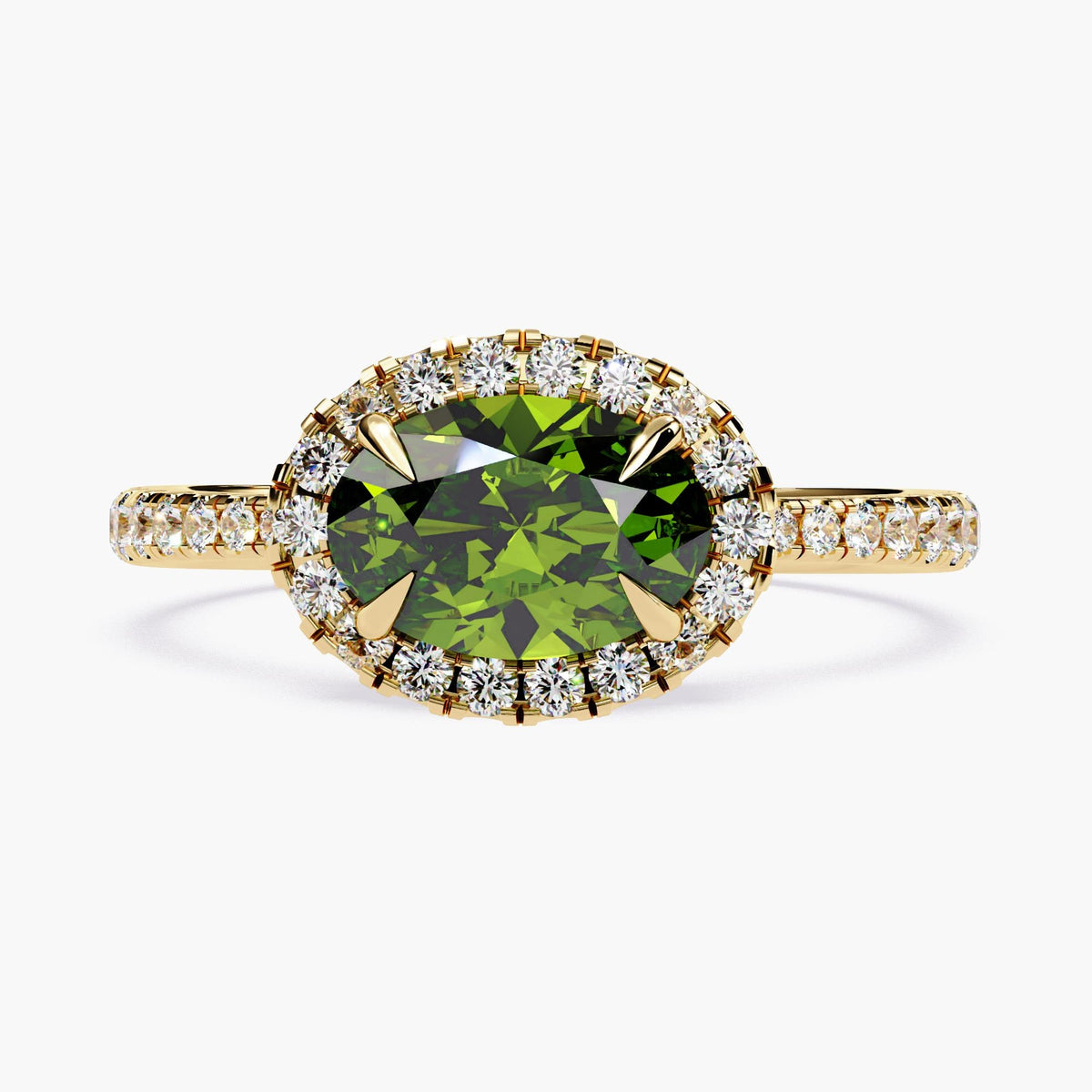 Oval cut emerald ring with diamonds surrounding the gemstone.