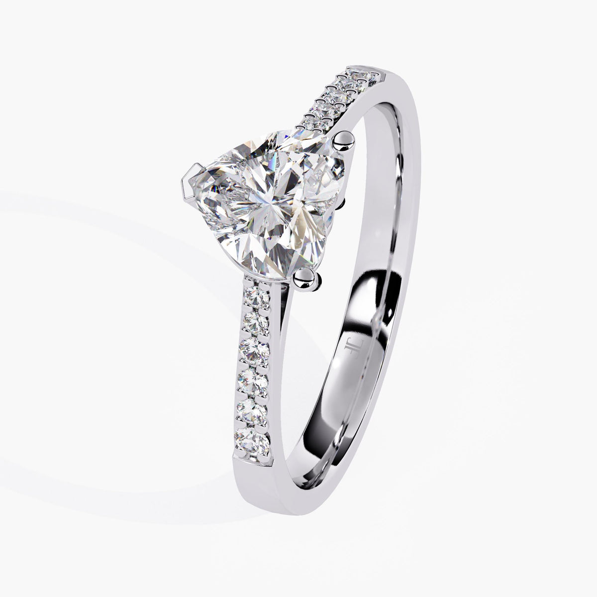 A white gold ring band featuring a heart-shaped diamond center stone, adorned with small round-cut stones on the sides.