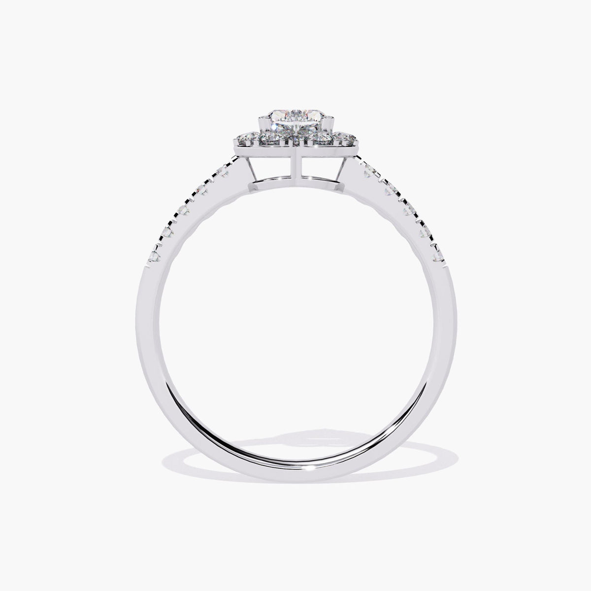 A heart-shaped diamond engagement ring with a halo setting and a white gold band.