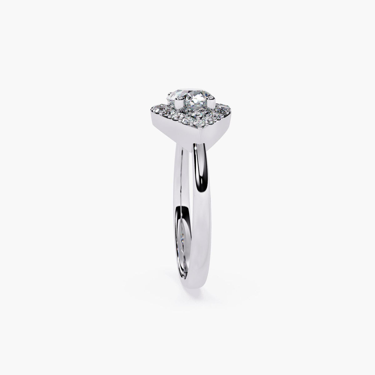 A white gold engagement ring with a marquise cut diamond center stone and a halo of smaller diamonds.