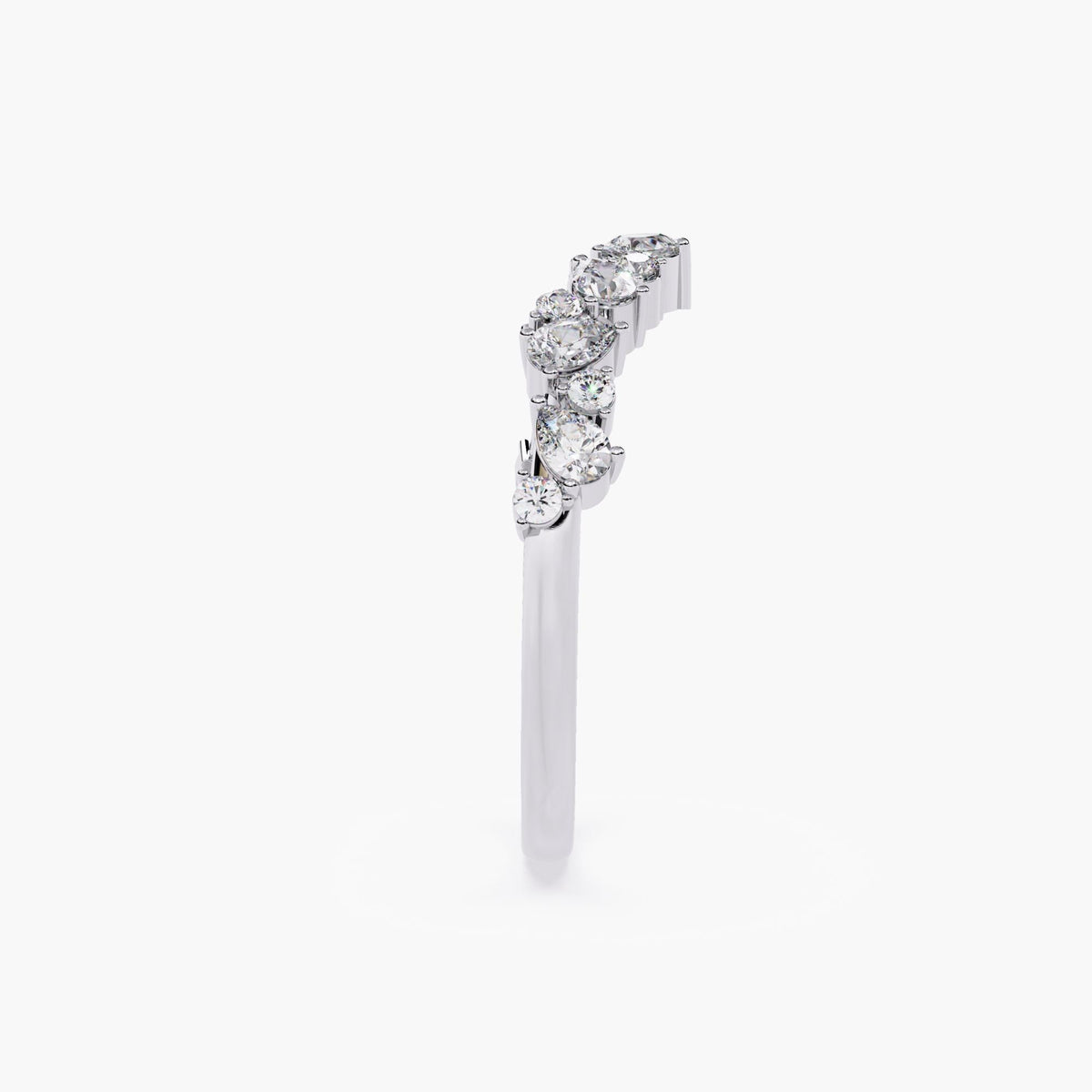 A curved white gold half eternity ring with marquise and round shaped diamonds.
