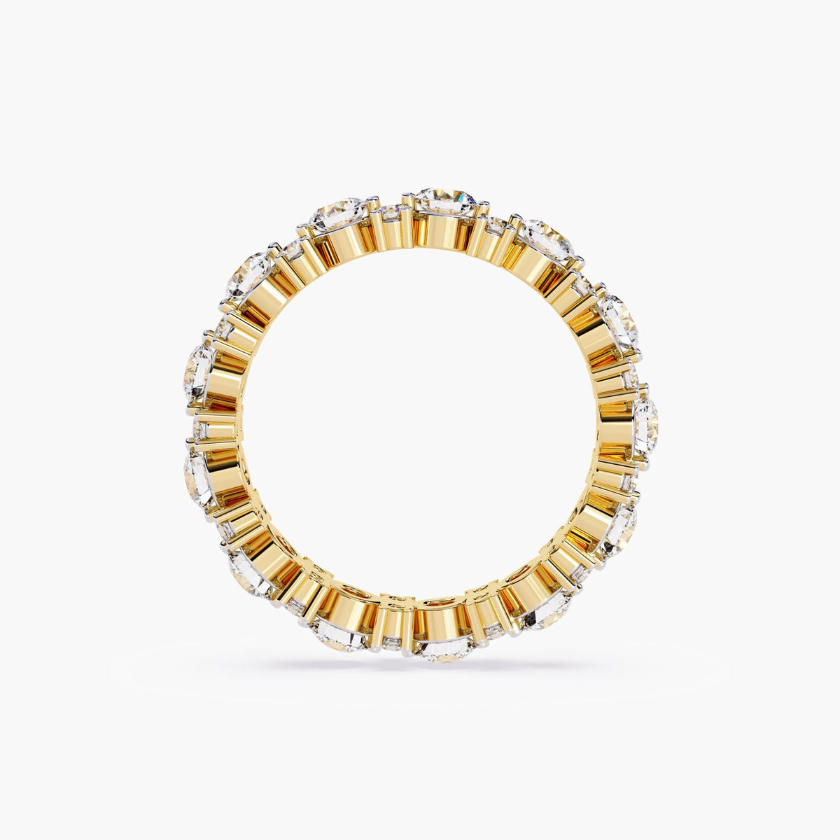 A gold full eternity ring with round cut diamonds in different sizes.