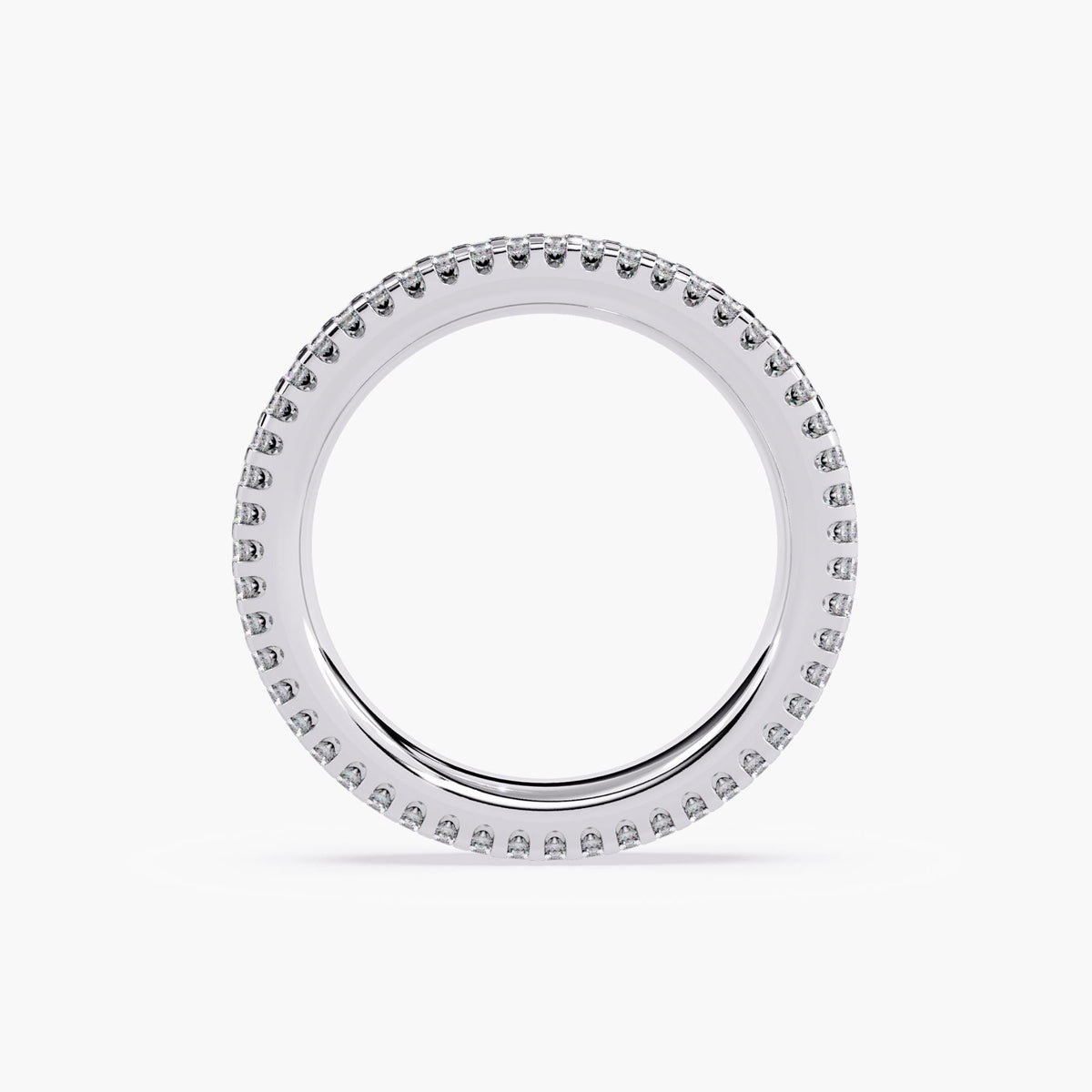 White gold eternity band with 3 rows of small diamonds around the band.