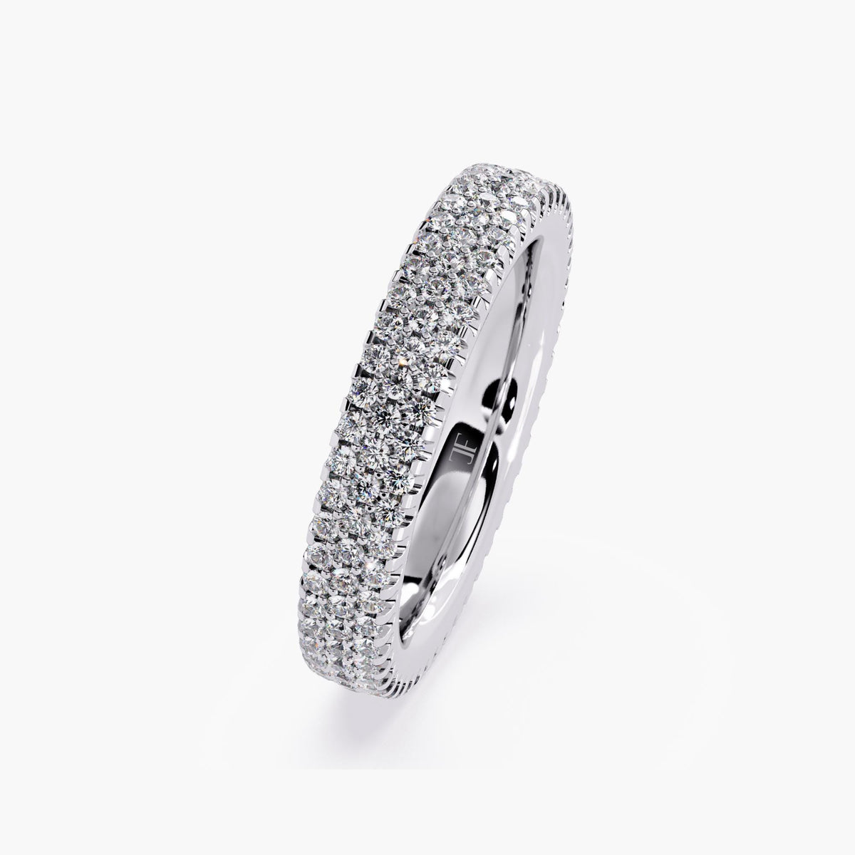 White gold eternity band with 3 rows of small diamonds around the band.