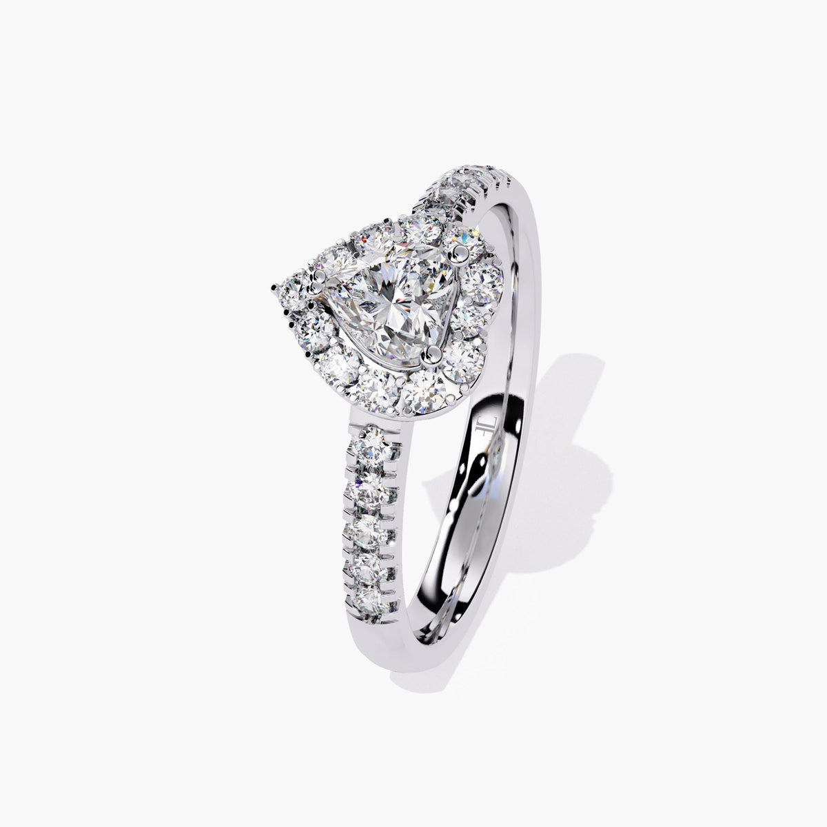 A heart-shaped diamond engagement ring with a halo setting and a white gold band.
