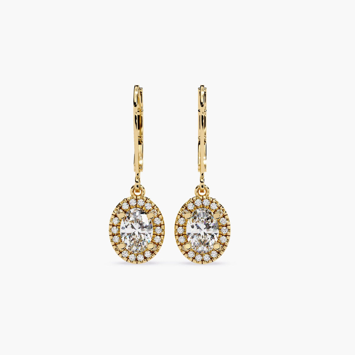 14K gold leverback earrings featuring oval lab-grown center diamonds surrounded by round diamond halo. The oval halo design creates a balanced, vintage-inspired silhouette with soft sparkle and drop movement.