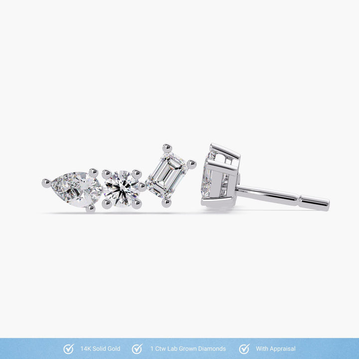 Side and front view of white gold ear climber earrings with lab-grown pear, round, and emerald cut diamonds, featuring secure pushback posts. Icons below highlight 14k solid gold, 1 ctw lab-grown diamonds, and appraisal included.