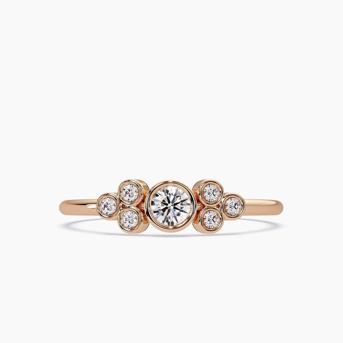This bubble ring is a true statement piece! Crafted in 14K solid gold, it features a stunning arrangement of seven round brilliant diamonds in a playful, bezel-set design. Its polished finish and dainty band make it ideal for everyday wear, while still packing all the sparkle and charm you could ask for.