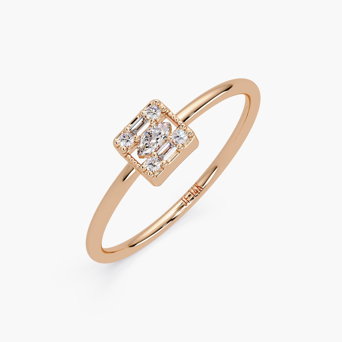 Angled view of the rose gold ring showing the diamond setting.