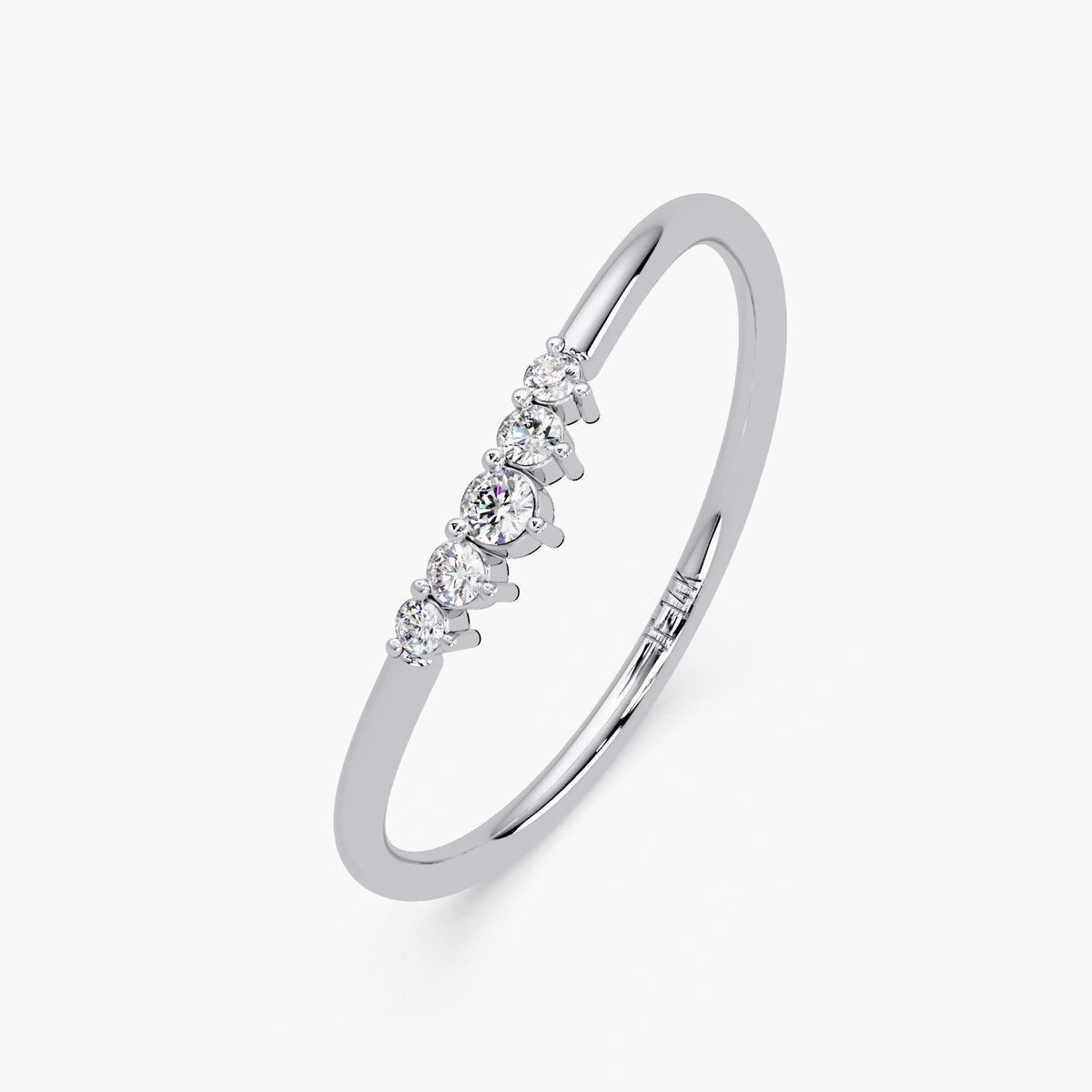 Angled view of the curved diamond ring in white gold.