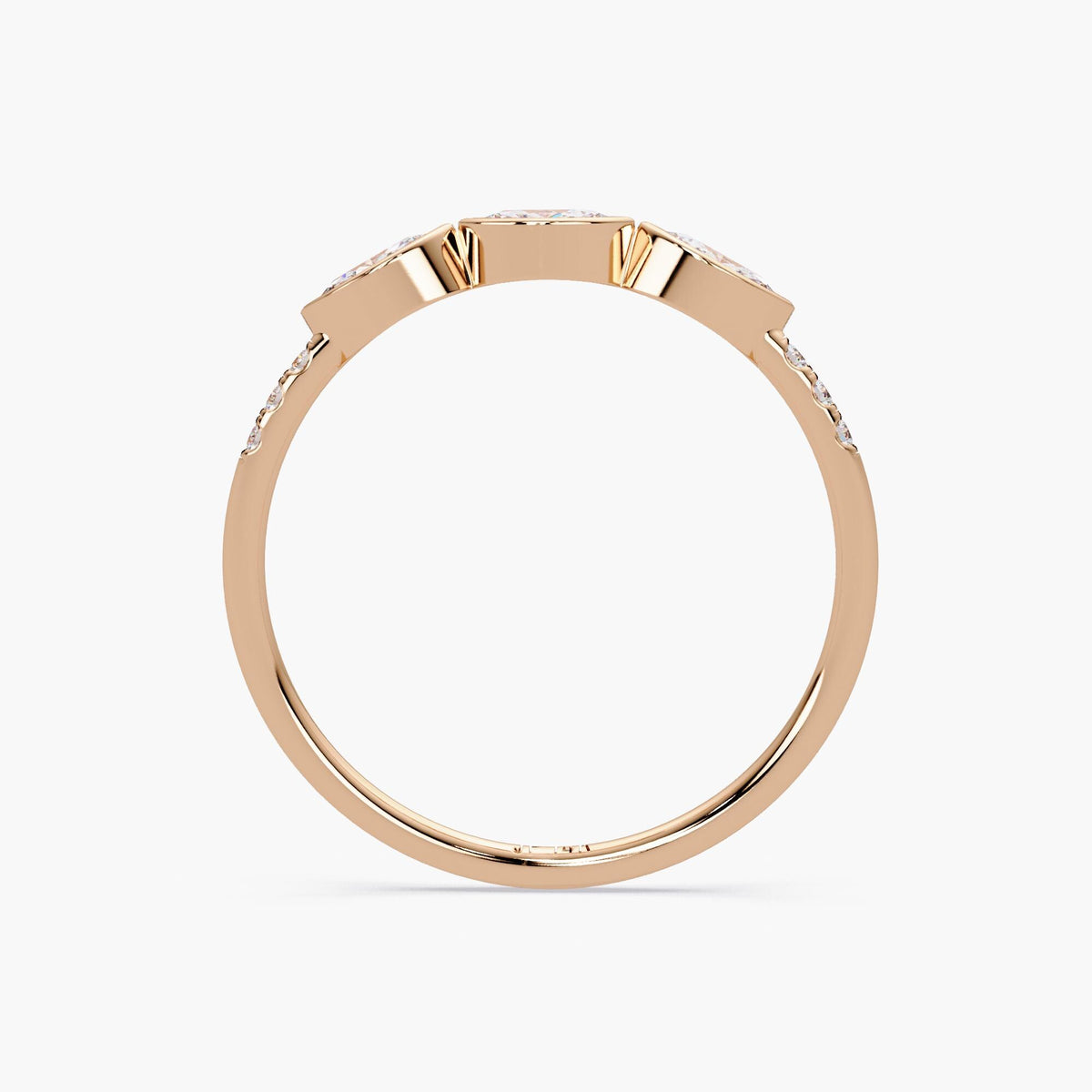 Side view of a 14K rose gold ring featuring three marquise diamonds set in bezel settings, with small round diamonds on the sides of the band.