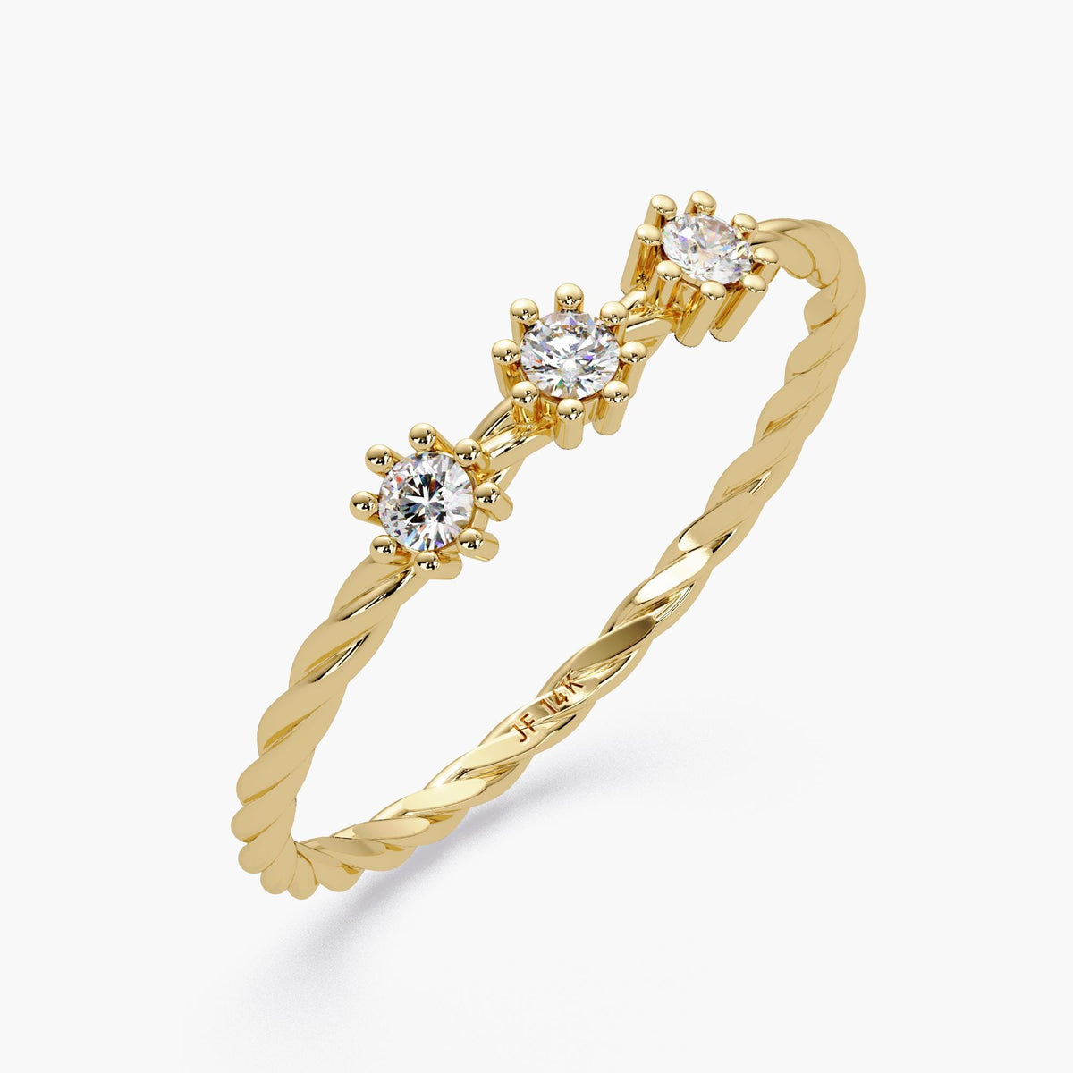 Angled view of a 14k yellow gold twisted band ring with three round natural diamonds in six-prong floral settings, showing the engraved 14k mark inside the band.