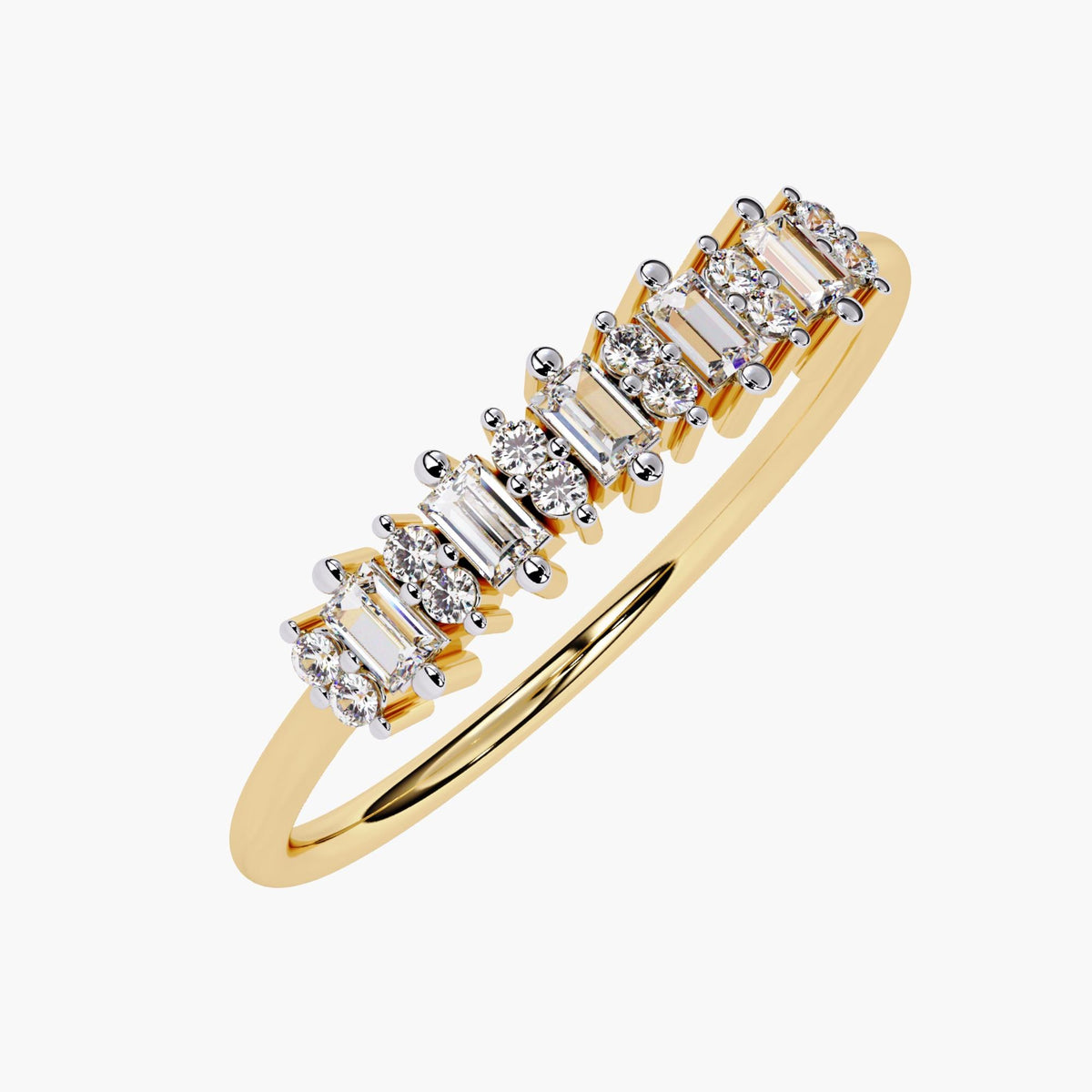 Angled view of a 14k yellow gold ring with alternating vertical baguette and round diamonds in a half eternity design. Each stone is set in prongs to catch the light from multiple angles. This ring pairs well with other bands or can be worn solo as a modern wedding or anniversary piece.