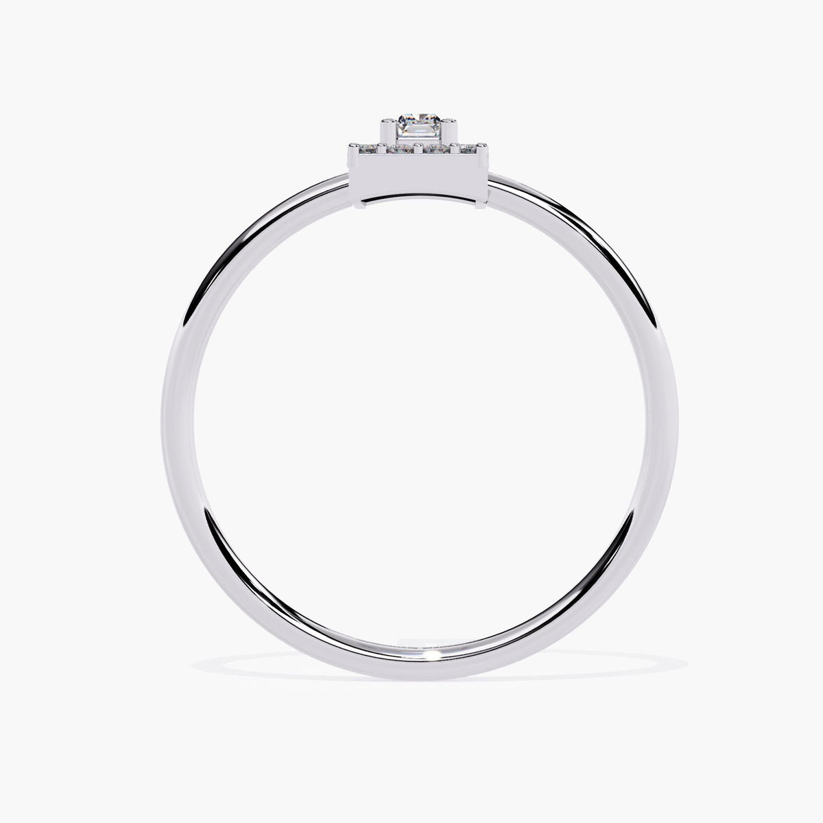 A side view of a white gold ring featuring a minimalistic design with a clean, polished band. The setting showcases a rectangular baguette-cut diamond, complemented by a row of round diamonds in a channel setting at the top, creating a sleek and modern look.