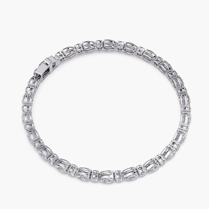 Back view of a 14k white gold diamond tennis bracelet shown in full circular form, highlighting flexible link design and secure clasp construction.