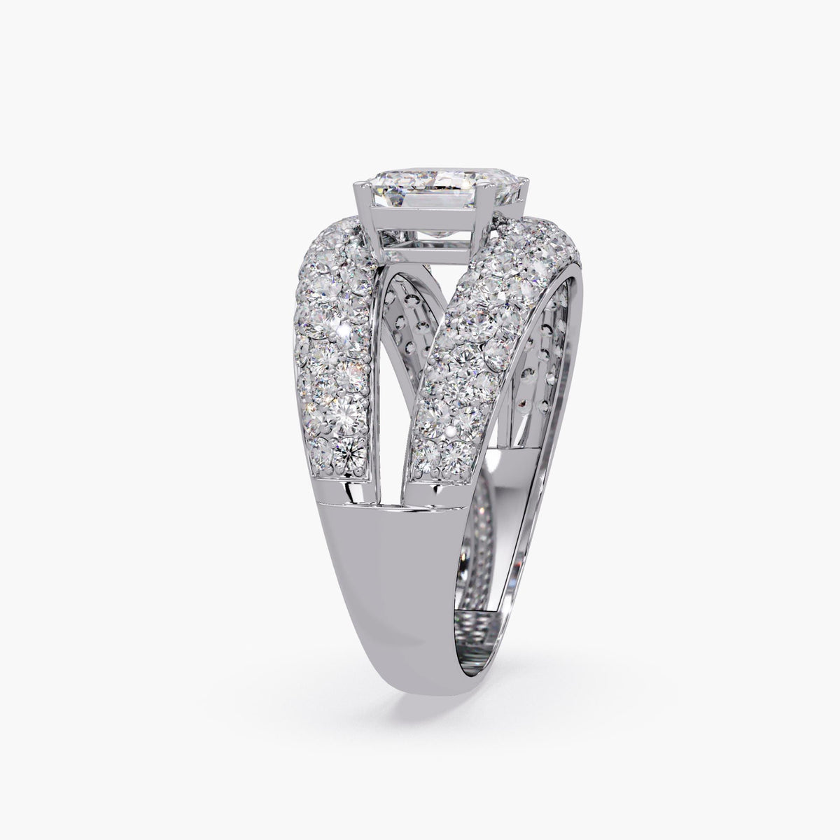 14k white gold dome ring featuring an emerald-cut lab-grown diamond in an elevated east-west setting, with pavé-set round diamonds running along the split band and an open gap beneath the center stone to create a sculptural floating effect.