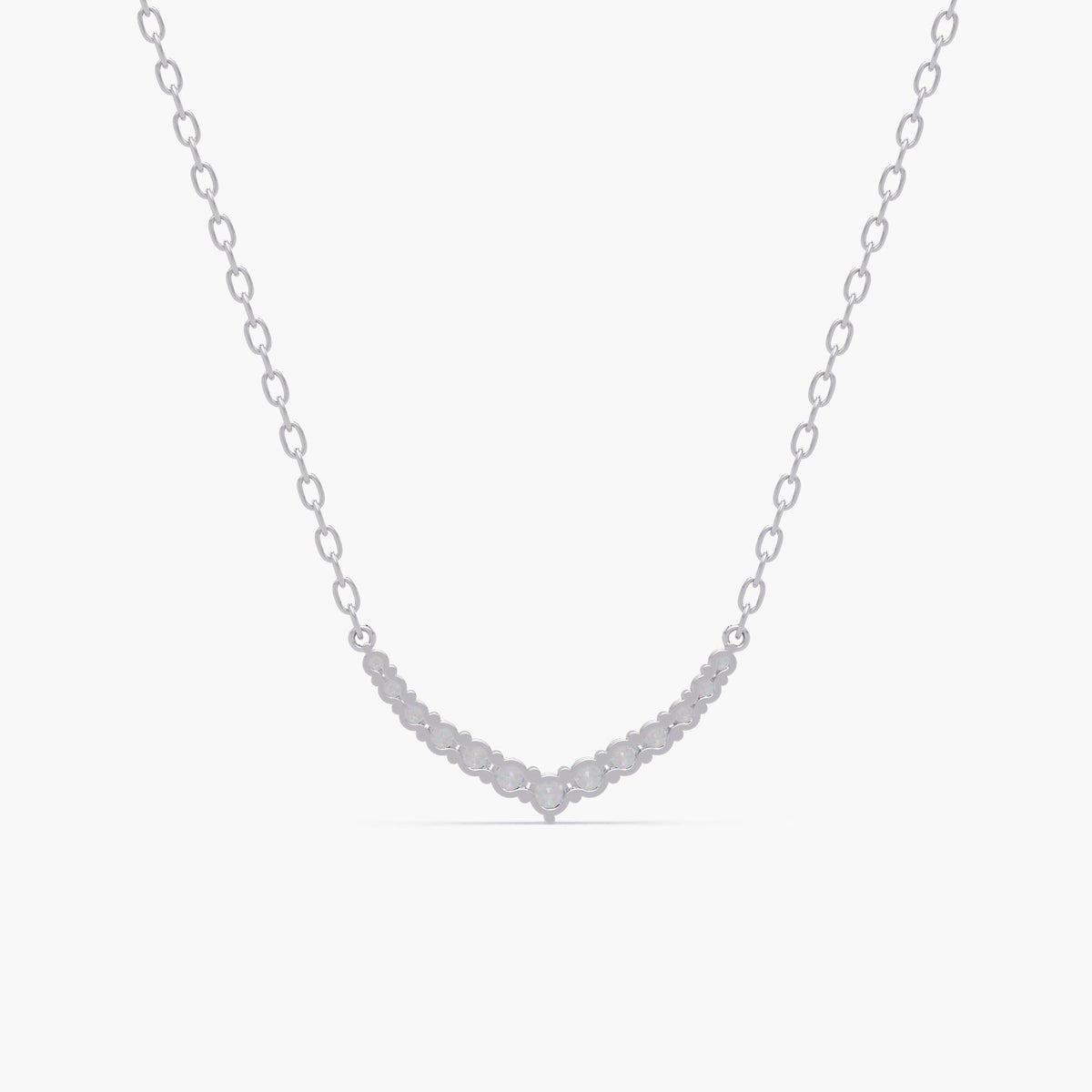 14k white gold V-shaped chevron necklace with round lab grown diamonds set in a curved bar pattern. The necklace features a delicate gold chain and a symmetrical diamond layout, forming a soft point at the center.