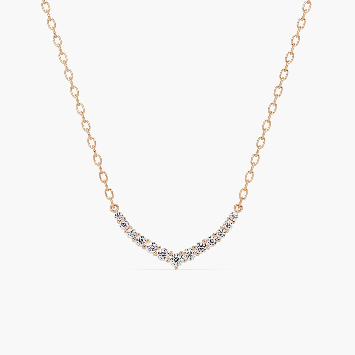 14k rose gold V-shaped chevron necklace with round lab grown diamonds set in a curved bar pattern. The necklace features a delicate gold chain and a symmetrical diamond layout, forming a soft point at the center.