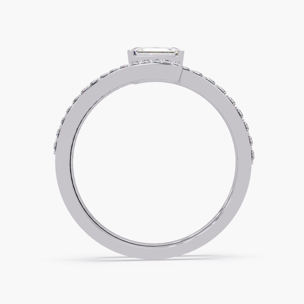 A 14K white gold wrap ring with a center emerald cut diamond and three rows of small round diamonds in a bypass setting. The open design wraps around the finger with sparkling pavé-set diamonds on each band. Excellent ring to wear as statement jewelry and on pointer finger