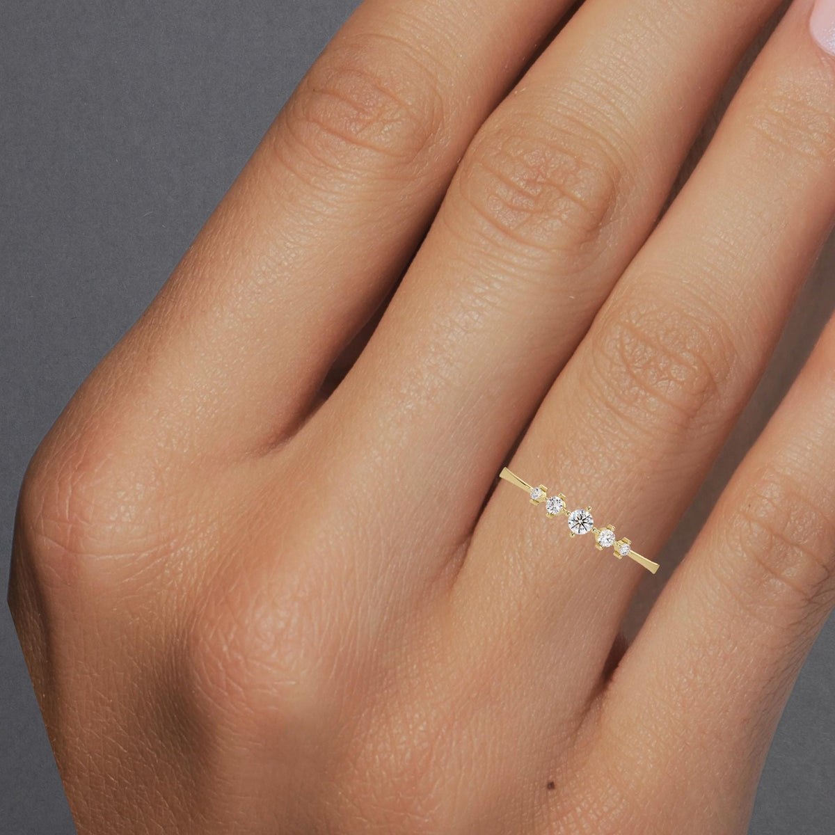 Dainty 5 Stone Diamond Tapered Ring Worn on Finger.