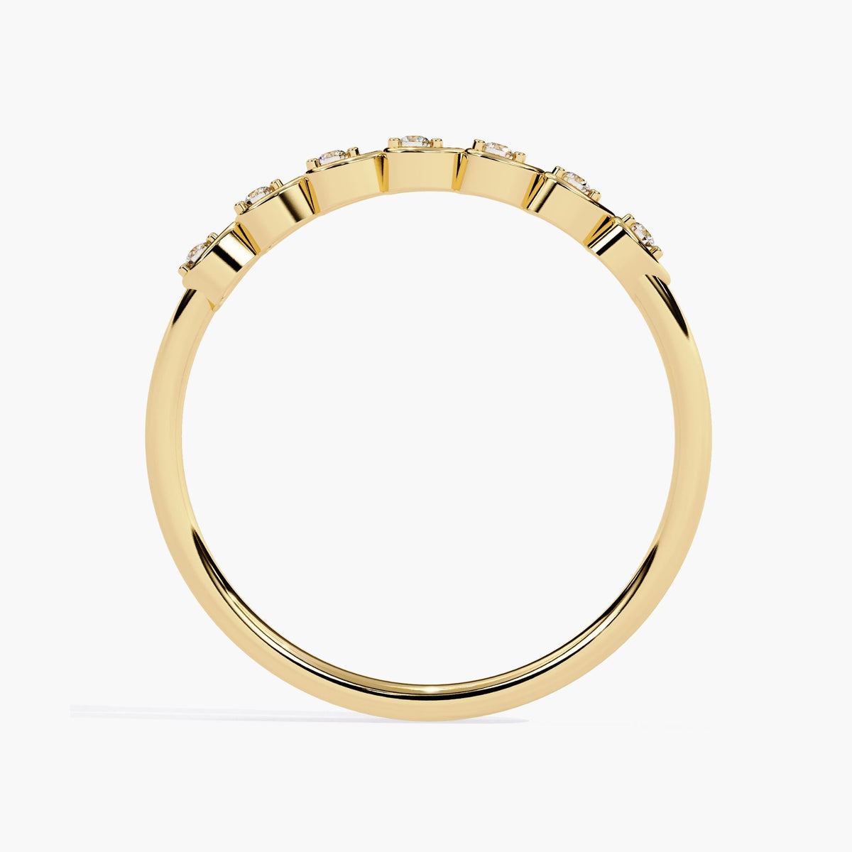 Back view of a 14k yellow gold diamond ring featuring scalloped edges beneath each of the seven pear-shaped bezel settings. The polished band is slim and smooth, with subtle dips that follow the diamond placement, enhancing the design’s elegant curvature.