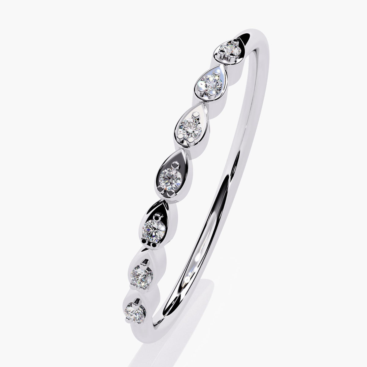 14k white gold band with seven round diamonds nestled inside pear-shaped bezels, arranged in a continuous line along the top. The slim band and mirrored symmetry make it ideal for bridal stacks or everyday layering.
