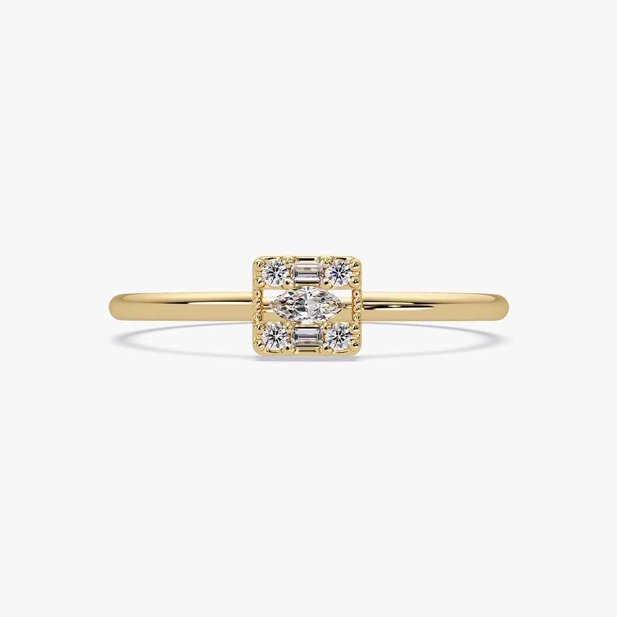 14k yellow gold ring with a marquise, baguette, and round diamond cluster on a thin band.