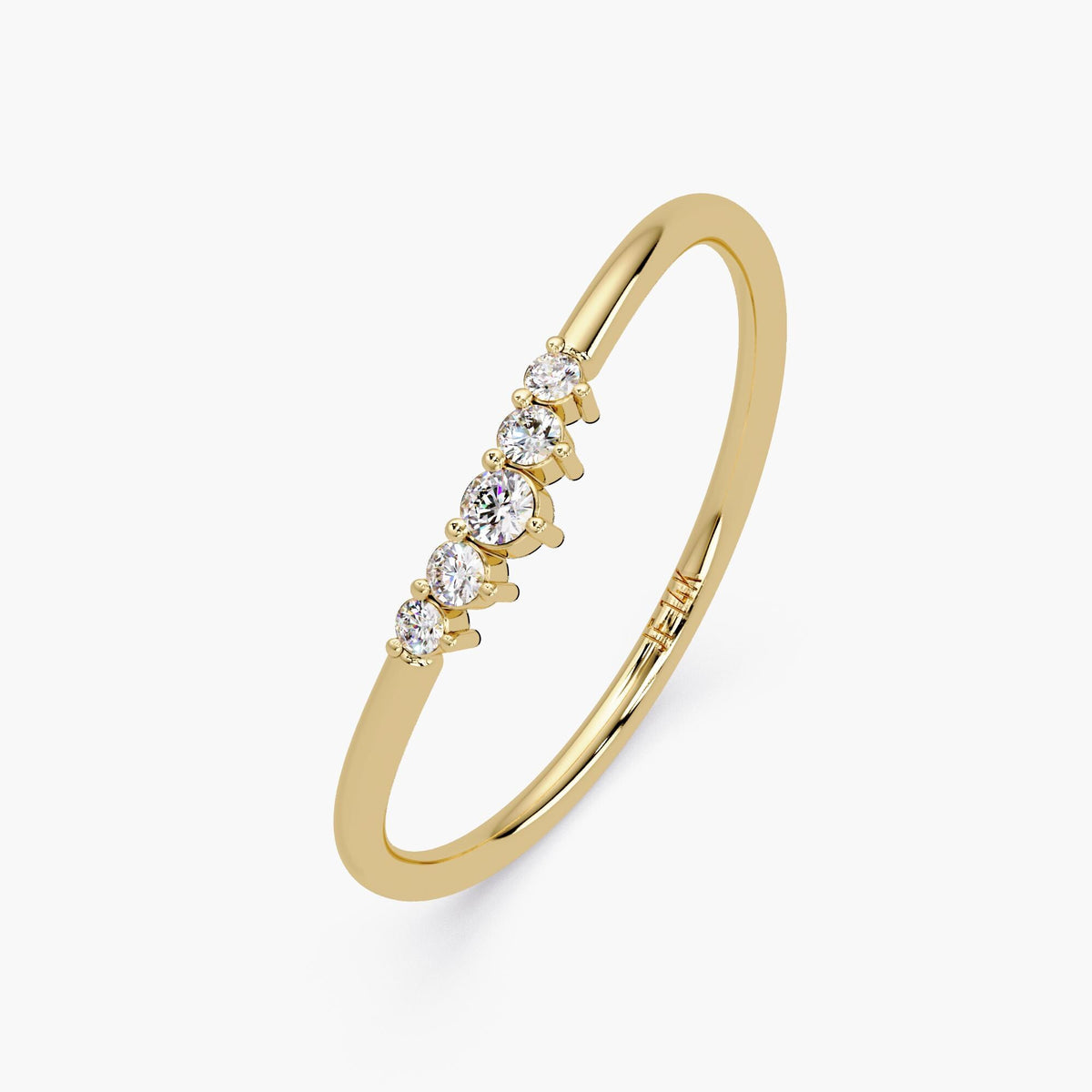 Angled view of the curved band in yellow gold with five diamonds.