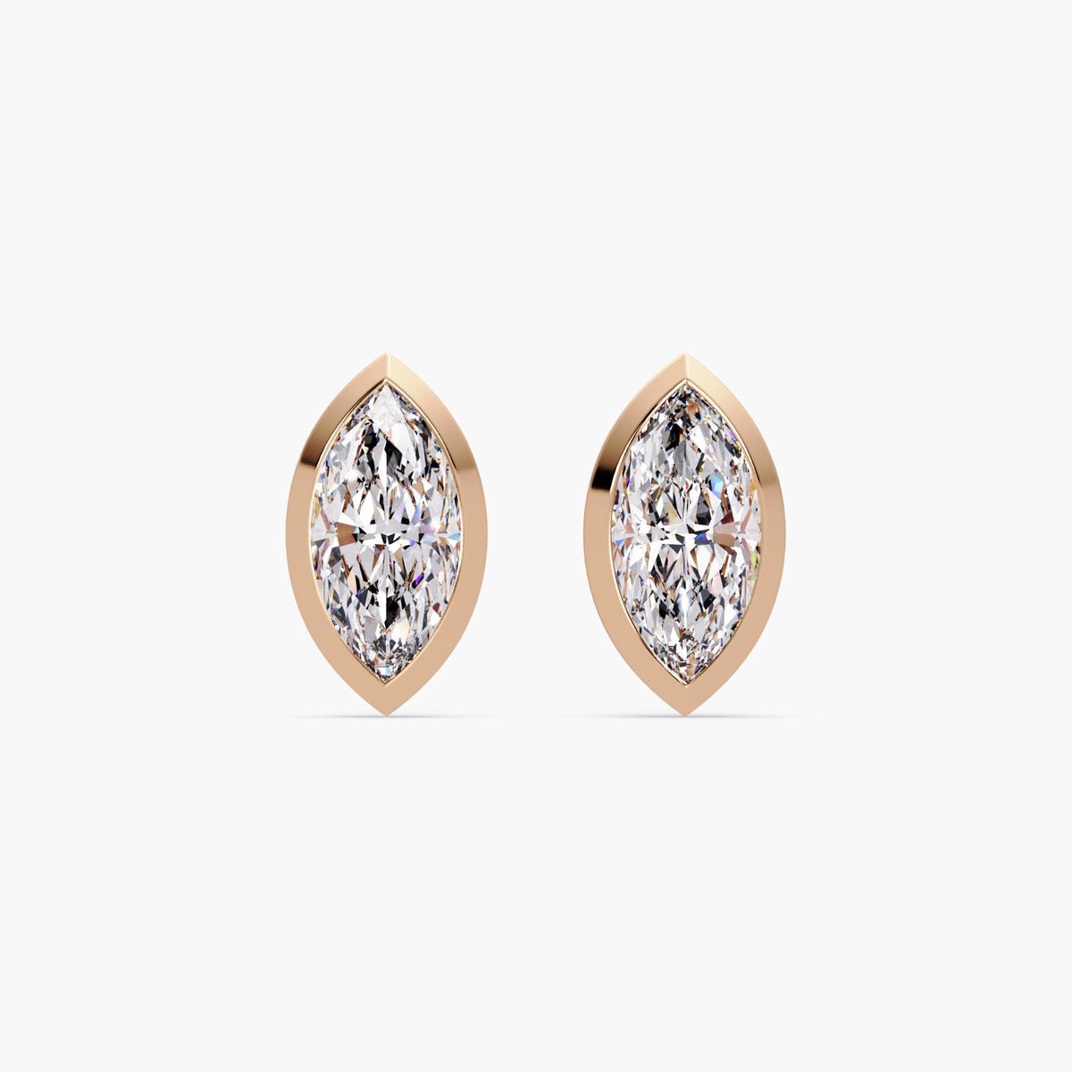 marquise cut lab grown diamond stud earrings in 14k rose gold bezel settings. The diamonds are set flush in a soft pink gold frame, creating a romantic and minimalist look perfect for everyday wear, gifting, or bridal styling.