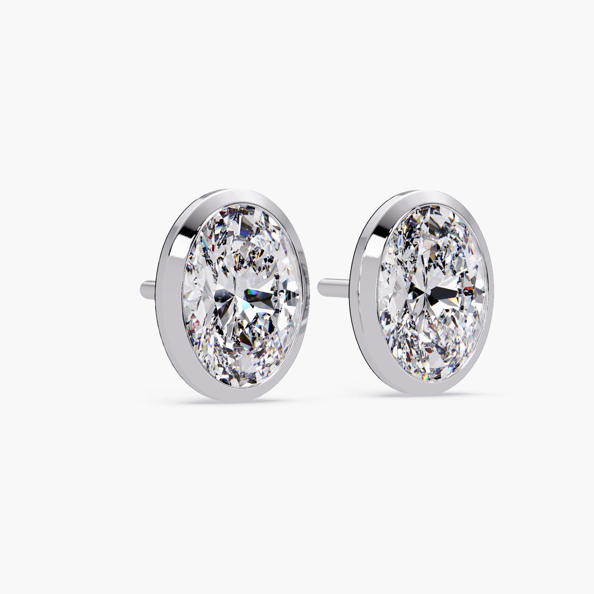 14k white gold bezel set oval diamond stud earring, showcasing the low-profile open gallery and straight pushback post. Designed for secure and comfortable everyday wear.