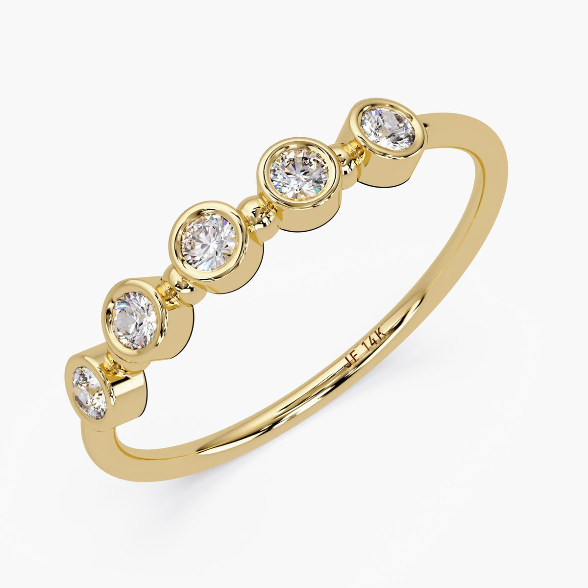 A side angle of 14K gold diamond band featuring five round diamonds set in bezel settings, with each diamond spaced evenly along the band, shown on a white background. It also showcases the thin shank