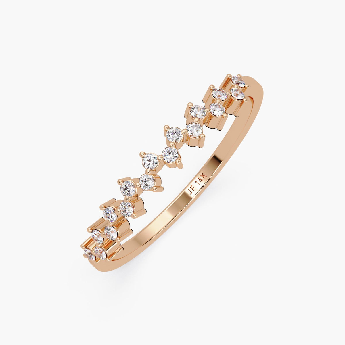 Angled view of a 14K rose gold zig zag diamond ring engraved with "JF 14K" inside the band. The ring features round diamonds set in a flowing, open zig zag pattern across the top.