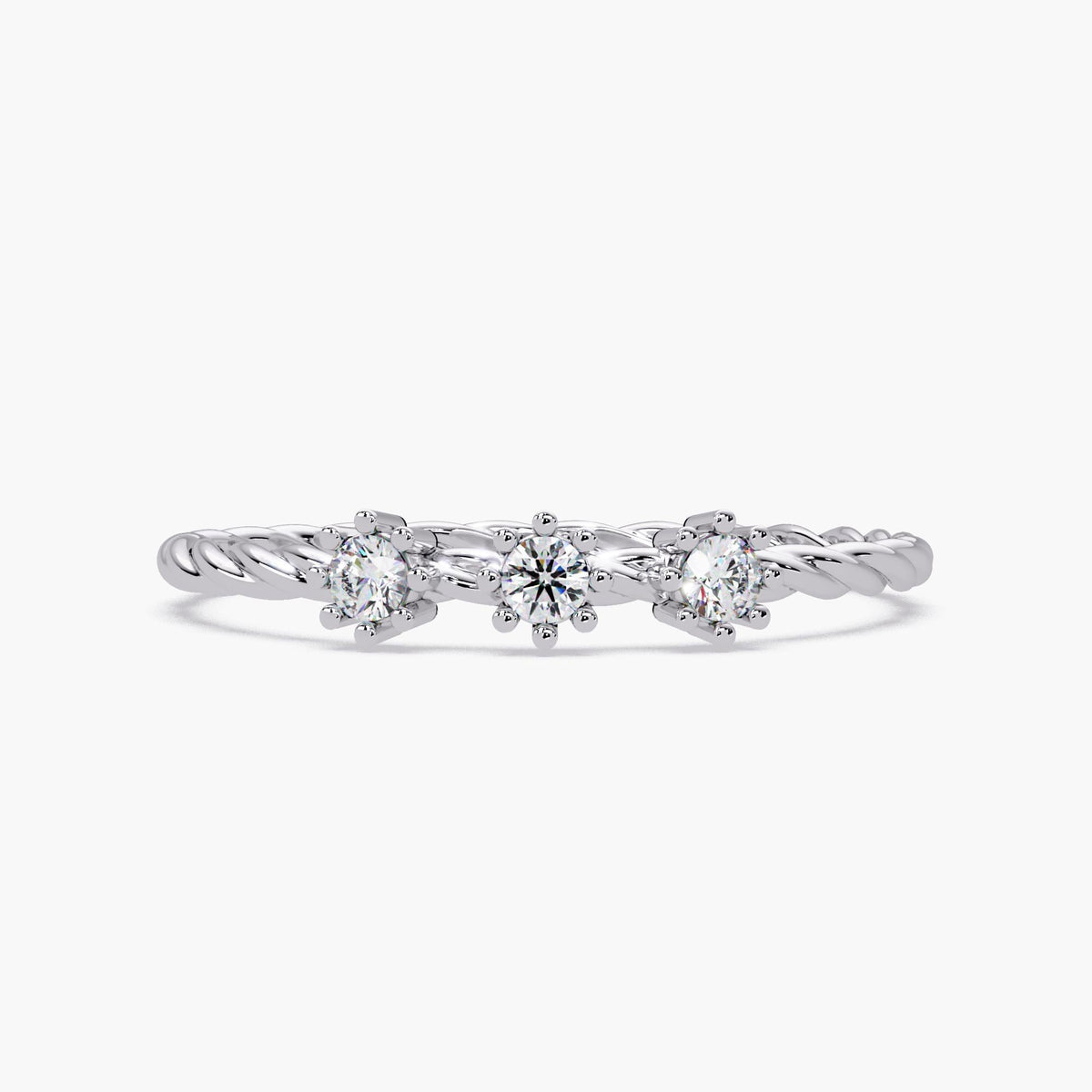Front view of a 14k white gold twisted band ring with three small round natural diamonds in six-prong floral settings.