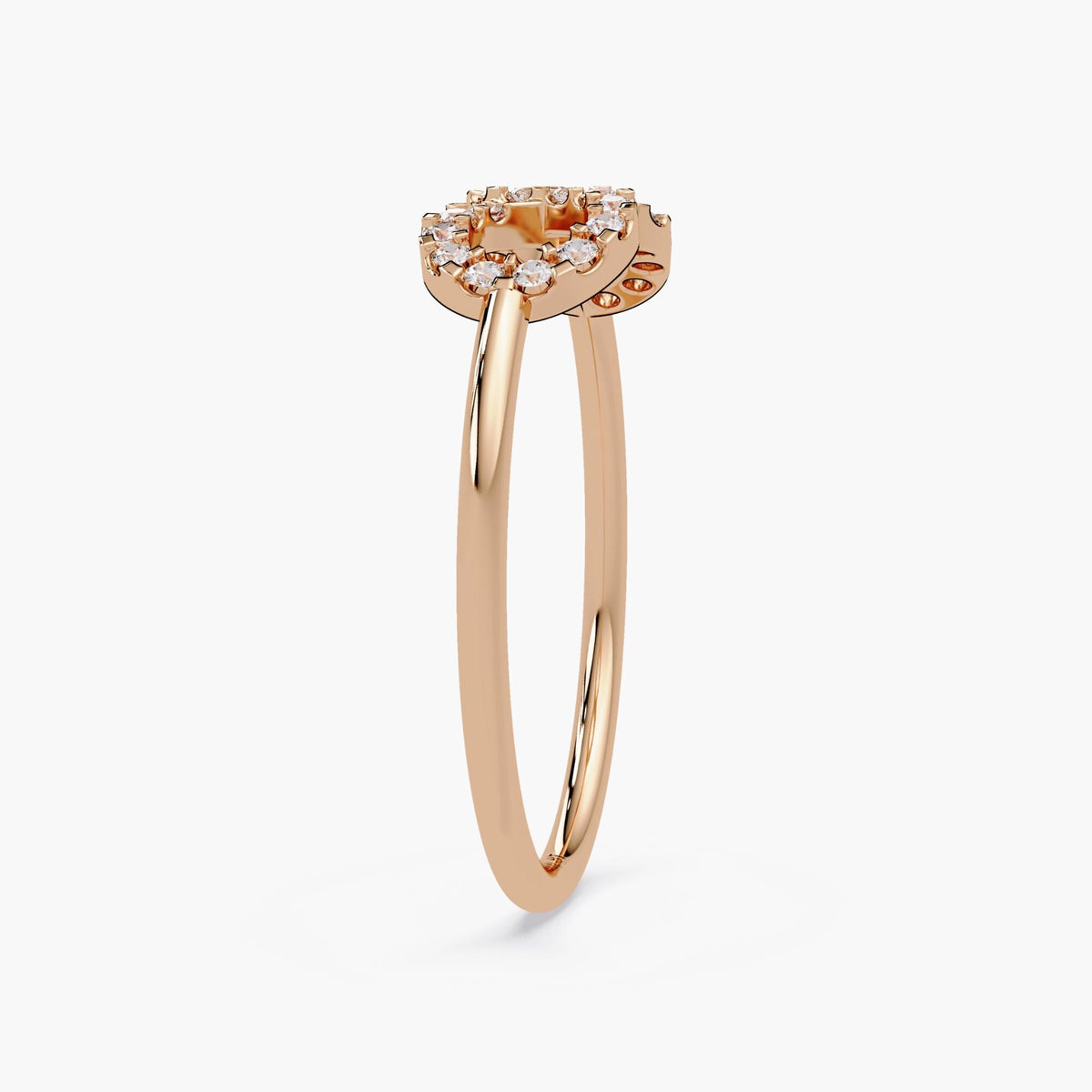 Side view of a 14k rose gold infinity diamond ring, highlighting the raised pavé-set infinity symbol and slim polished band.