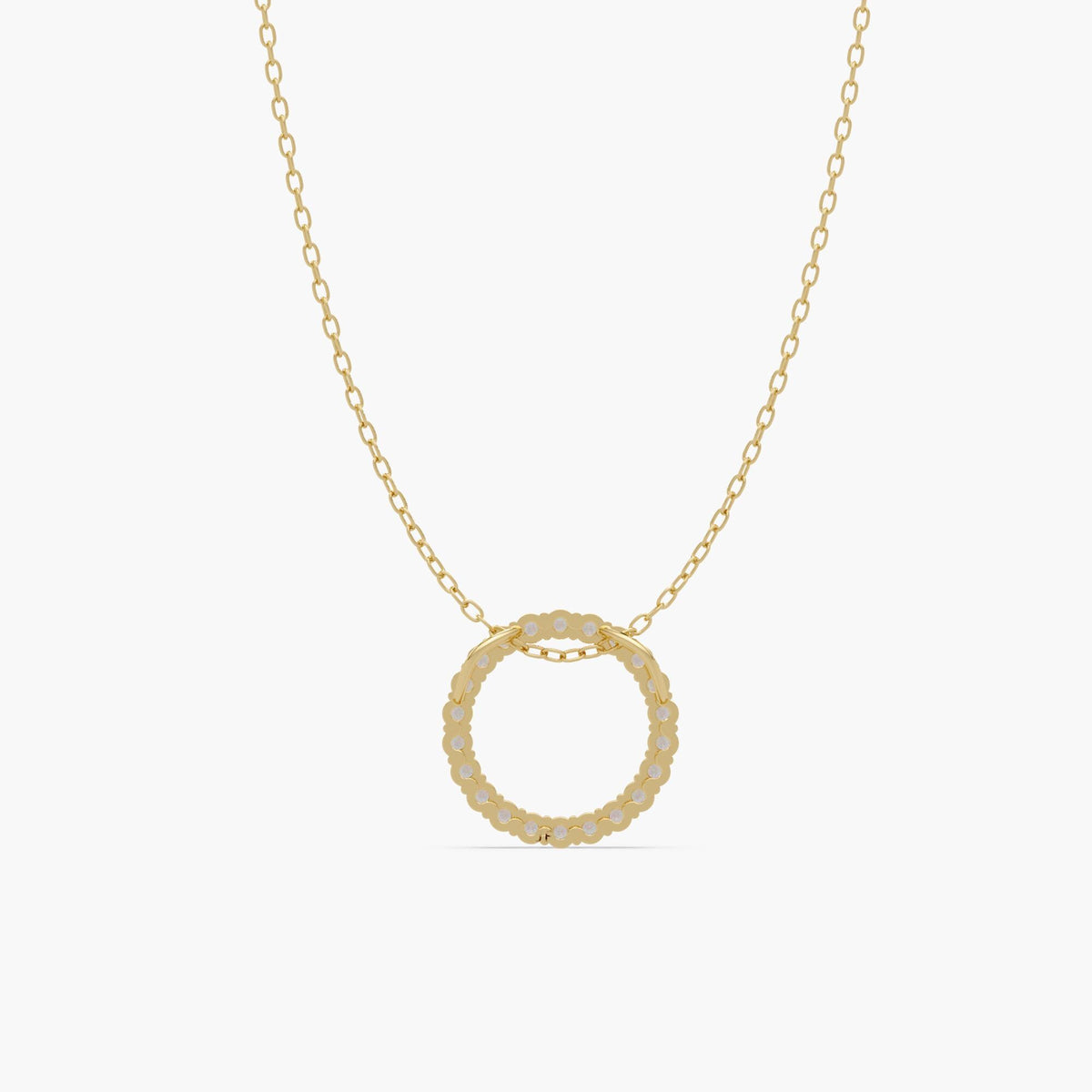 Back view of a 14k gold open circle pendant showing the solid gold gallery and prong settings behind the natural round diamonds.