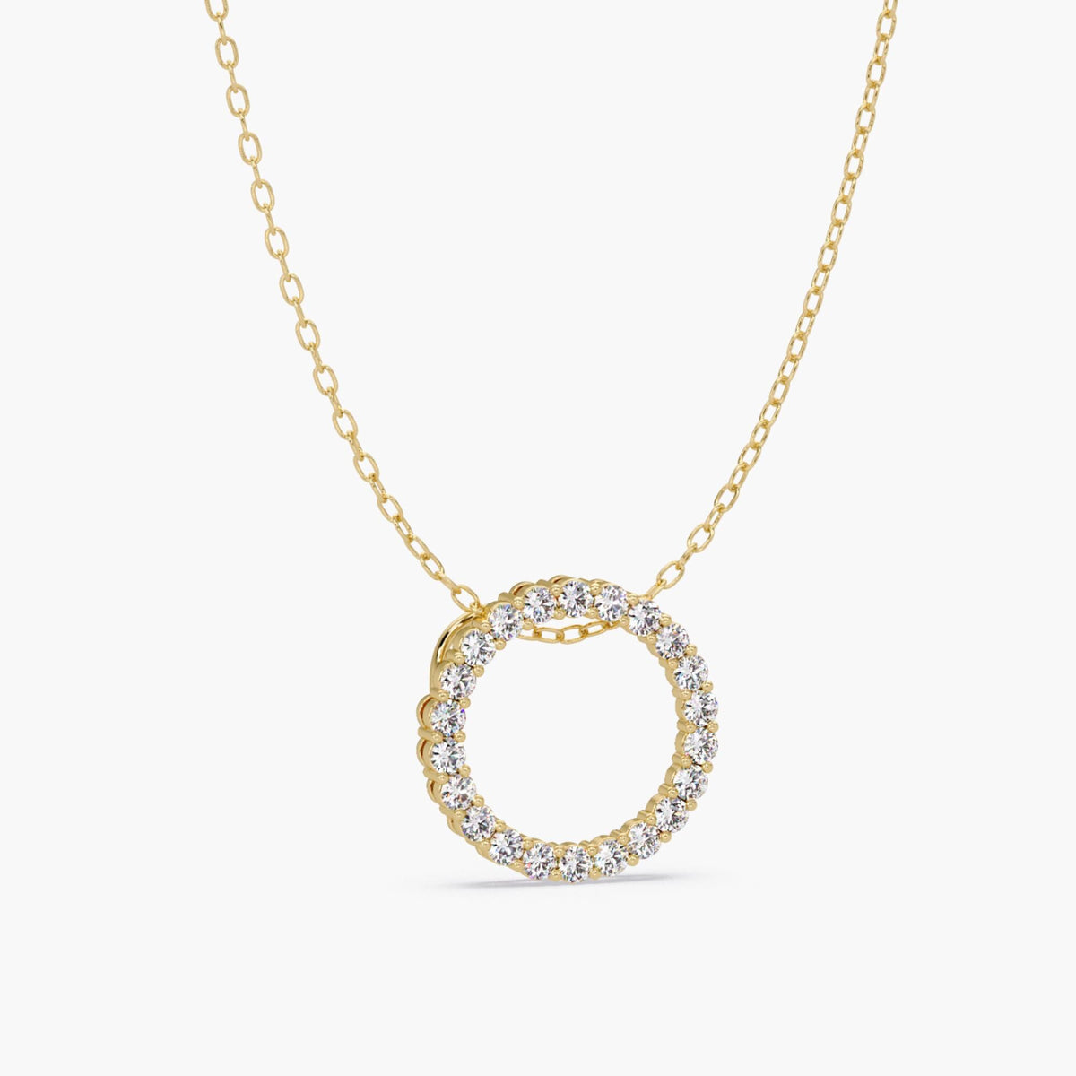 14k open circle diamond pendant with natural round diamonds set in a full eternity design. A solid gold pendant on a cable chain.