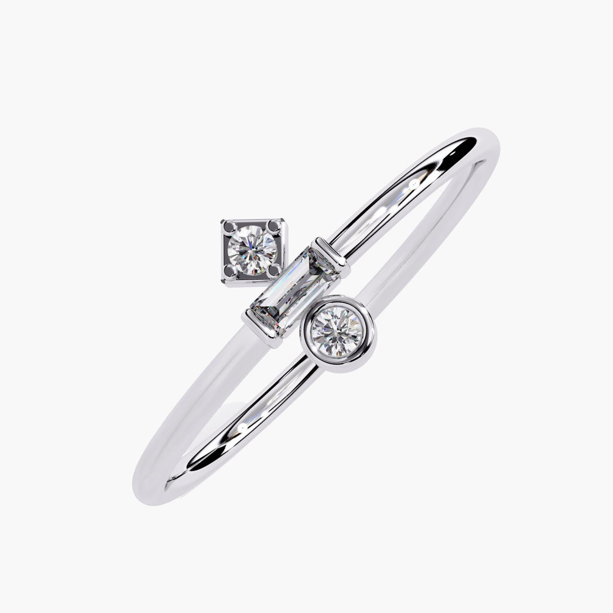 Angled view of a 14k white gold ring featuring three lab-grown diamonds in a geometric arrangement. A round diamond in a square setting sits above a horizontal baguette, paired with a bezel-set round diamond below. The polished band and asymmetrical layout give the piece a sleek, design-forward look for stacking or gifting.