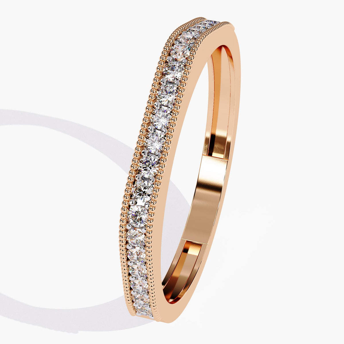 Angled view of a 14k rose gold ring showcasing a flat-top silhouette with a full row of lab-grown round diamonds and milgrain detailing along the edges. This piece works well as a stand-alone statement or paired with other slim bands for a layered wedding stack.