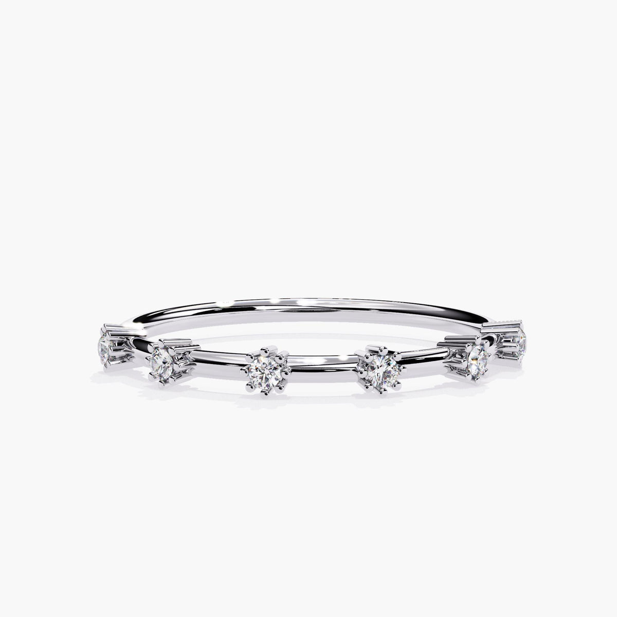 Front view of a 14k white gold distance diamond band with six round natural diamonds spaced evenly along a slim 1.3mm band. Each 1.5mm diamond is set in raised claw prongs, creating a floating illusion across the sleek polished band.