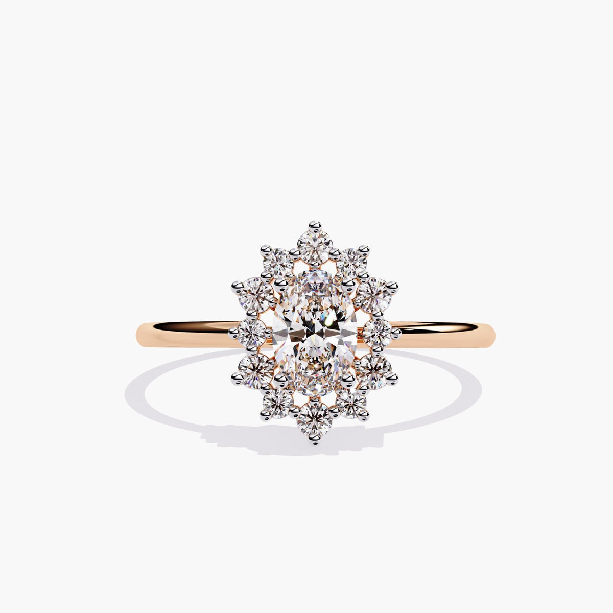 14k rose gold ring featuring a 0.5 carat oval lab-grown diamond surrounded by a floral starburst halo of round diamonds. The design sits on a thin, polished band with warm rose tones.