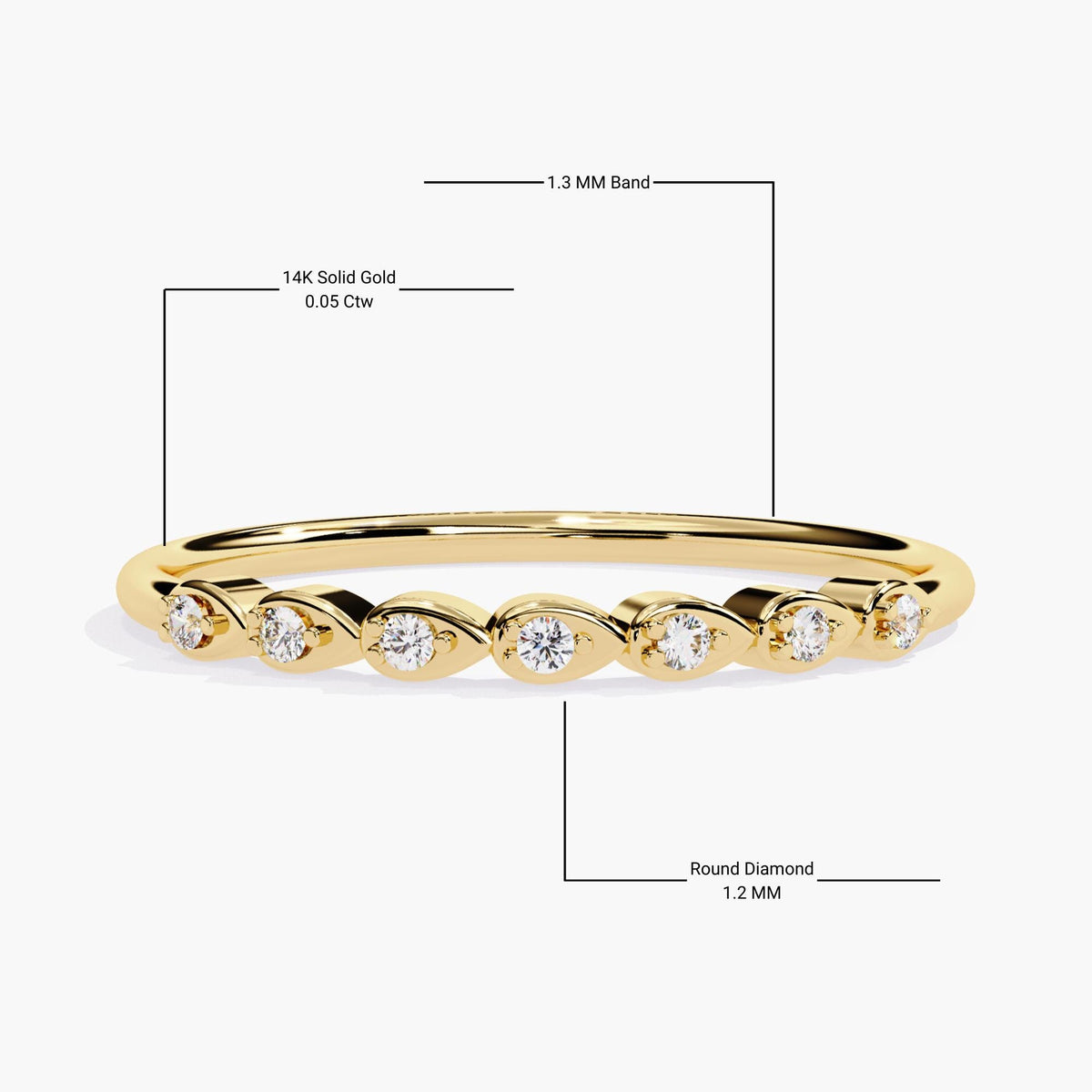 14k yellow gold ring with seven 1.2mm round natural diamonds set in individual pear-shaped bezels. The dainty 1.3mm band creates a delicate look with 0.05 ctw of sparkle, perfect as a stacking ring, anniversary band, or everyday fine jewelry.
