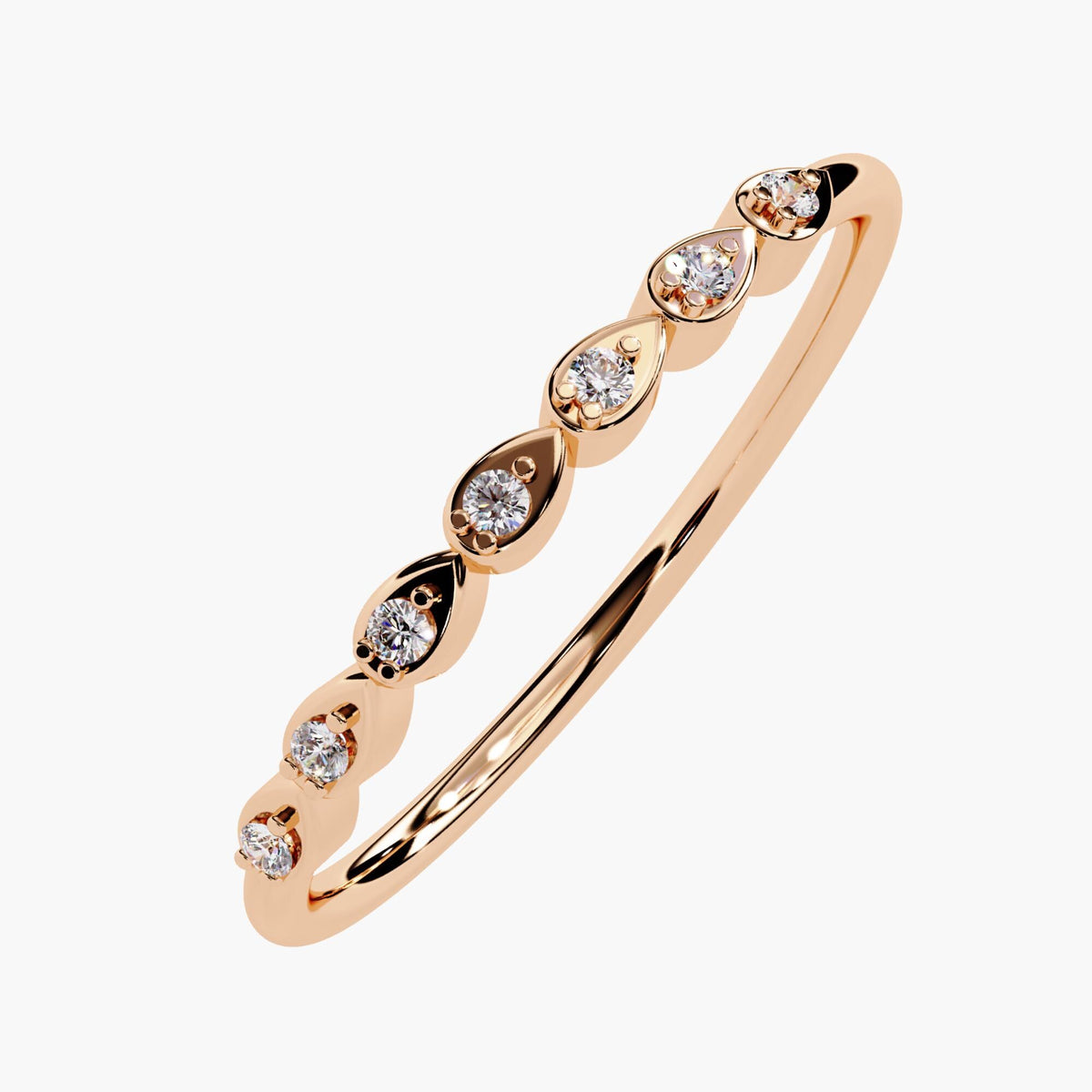 14k rose gold stacking ring with seven round diamonds set in alternating pear-shaped bezels, creating a unique and delicate design.