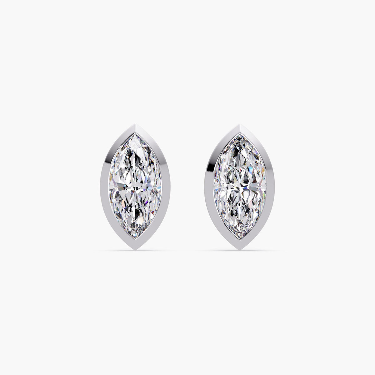 marquise cut lab grown diamond stud earrings in 14k white gold bezel settings. The diamonds have pointed tips and a modern, elongated shape, creating a clean and elegant silhouette ideal for everyday wear or gifting.