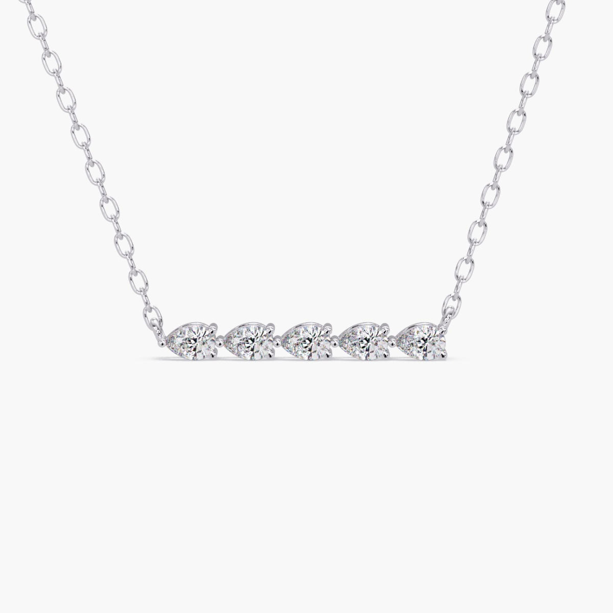 14k white gold necklace featuring five pear-shaped lab-grown diamonds in a straight horizontal bar layout. Each diamond is prong set and connected to a fine white gold chain.