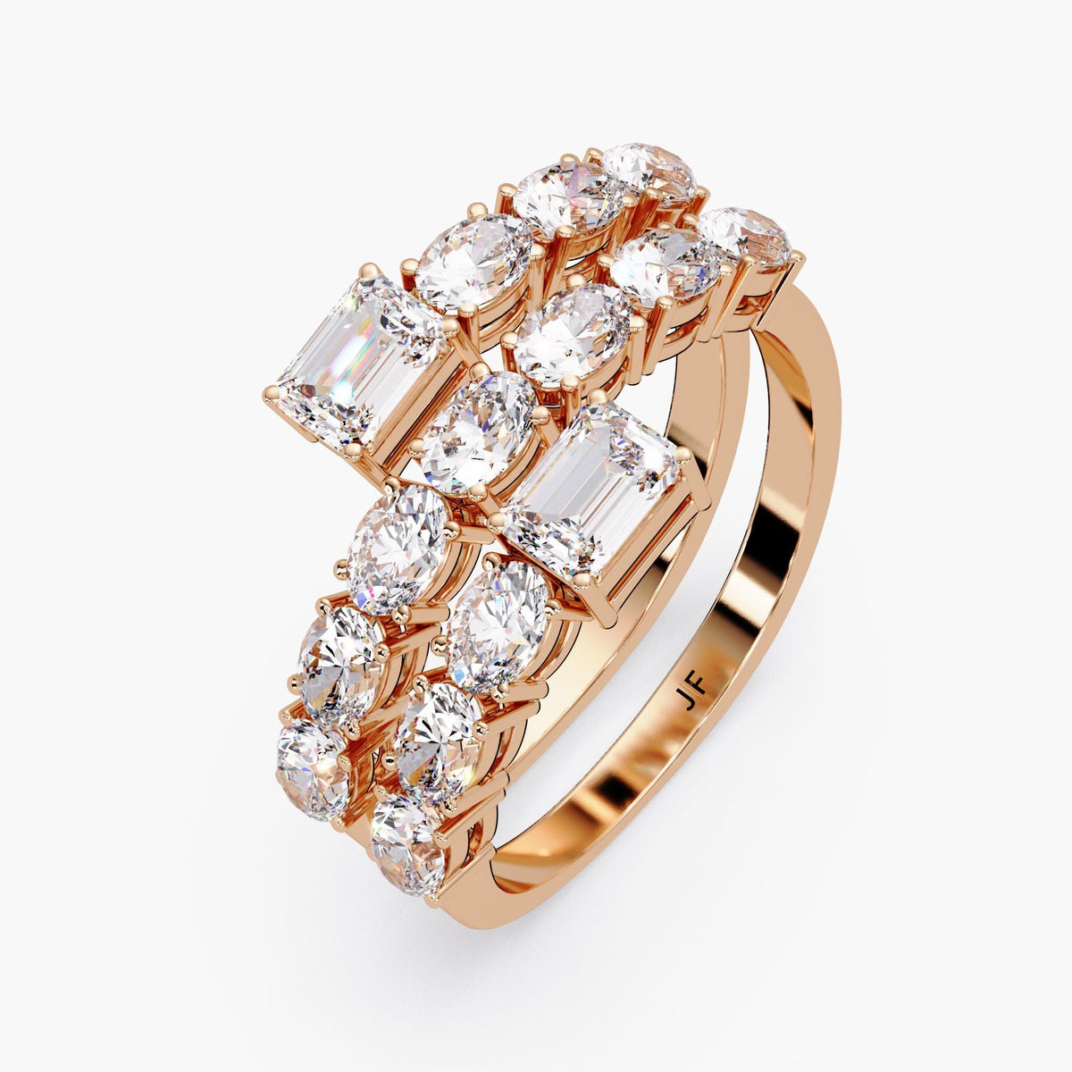 a spiral wrap ring in rose gold featuring two emerald cut diamonds at each open end, with two rows of oval diamonds set in shared prongs along a curved bypass band.