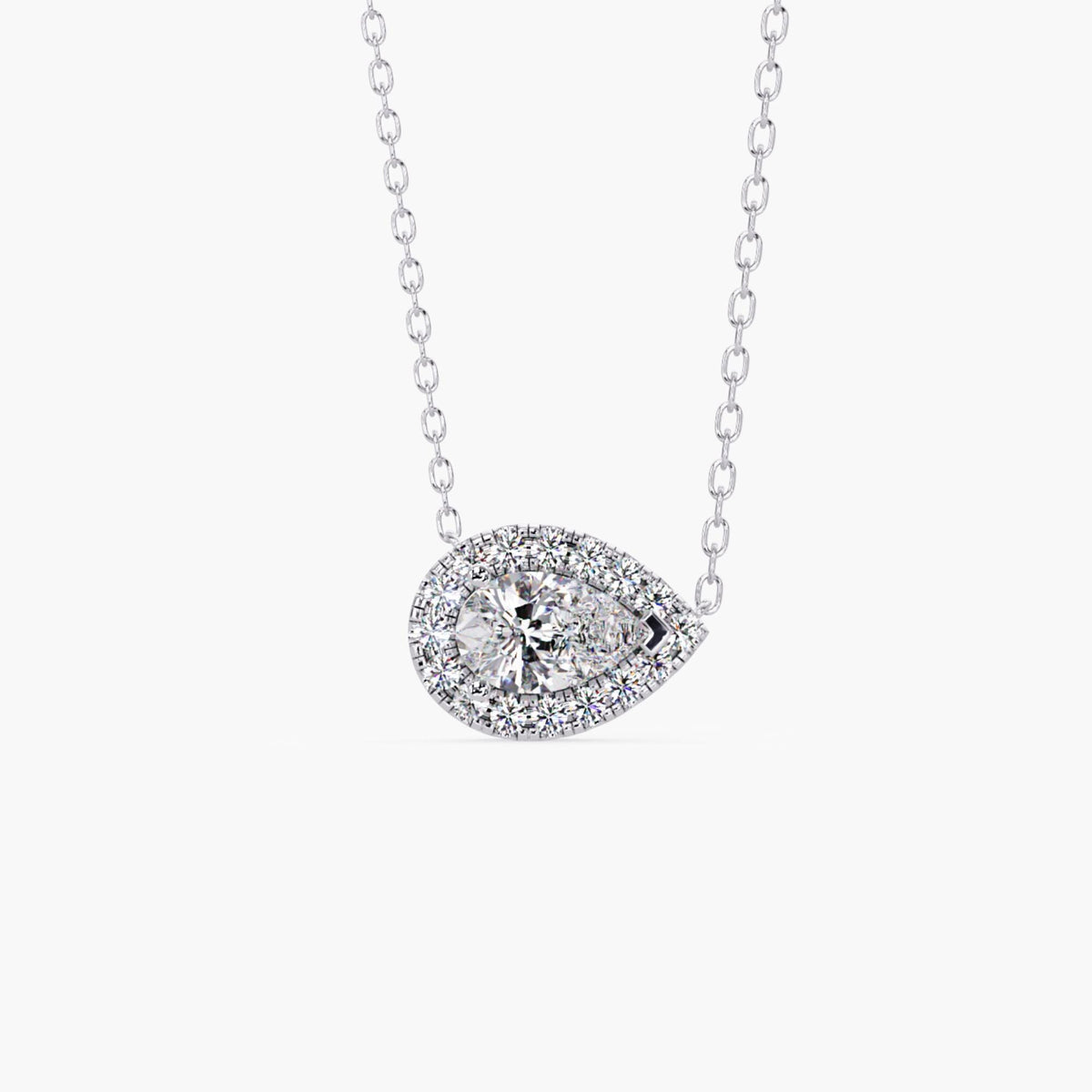 14k white gold pear diamond pendant with a 1ct lab grown pear-shaped center diamond surrounded by a halo of round diamonds in an east west setting.