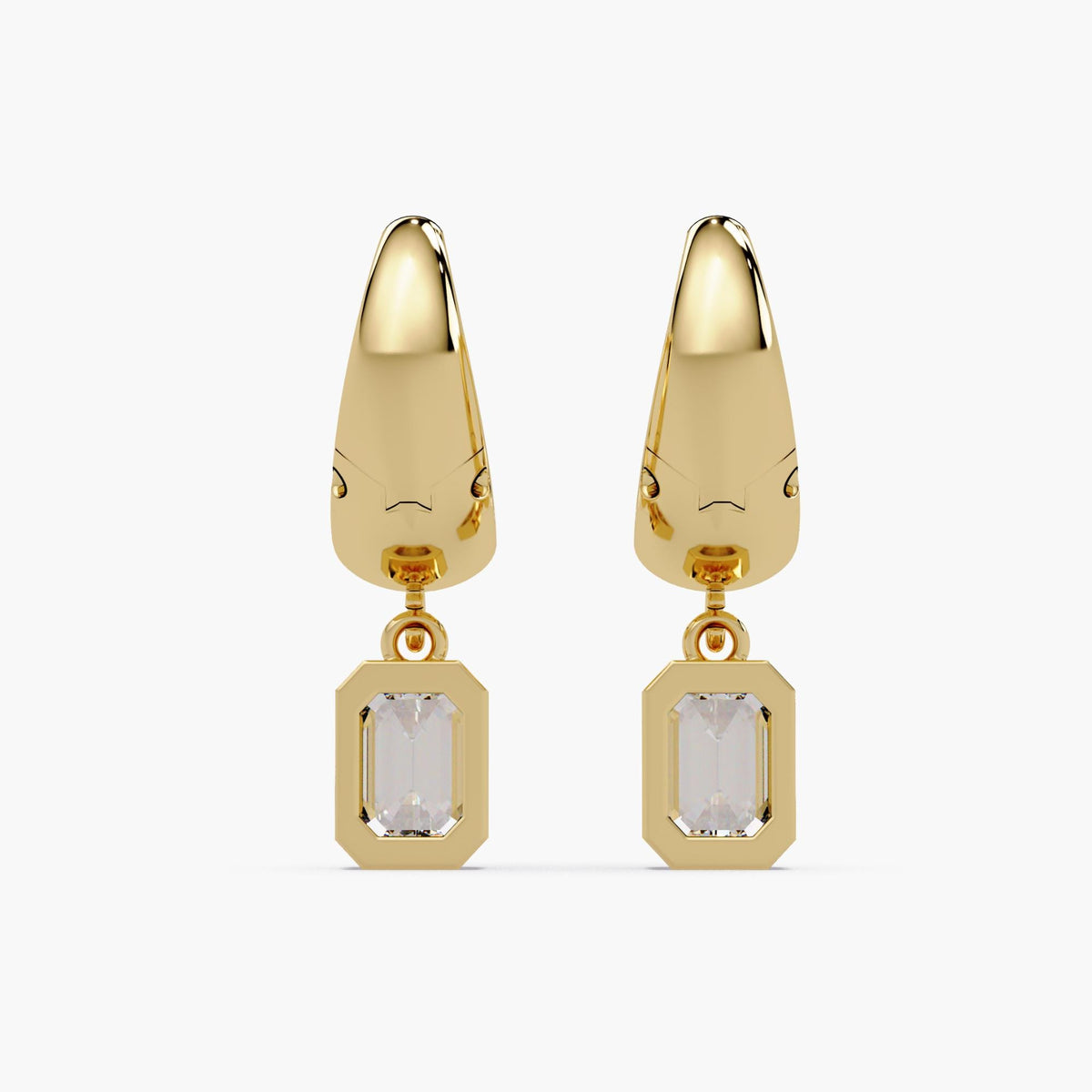 Front view of dainty 15mm 14K gold huggie hoop earrings with leverback closure, featuring bezel-set emerald cut lab-grown diamond charms in a teardrop-inspired dangle design. The minimalist gold setting frames each diamond with gold bezel
